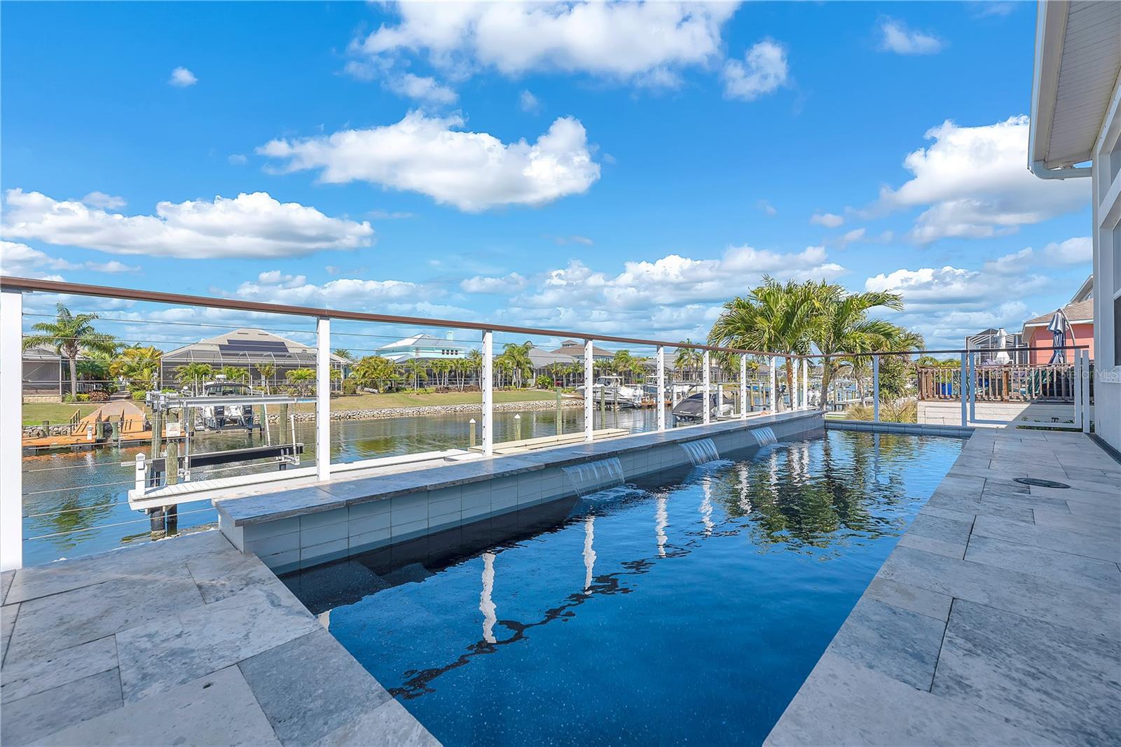 The saltwater pool and inviting waterfalls features invite you to cool off or unwind with an evening swim