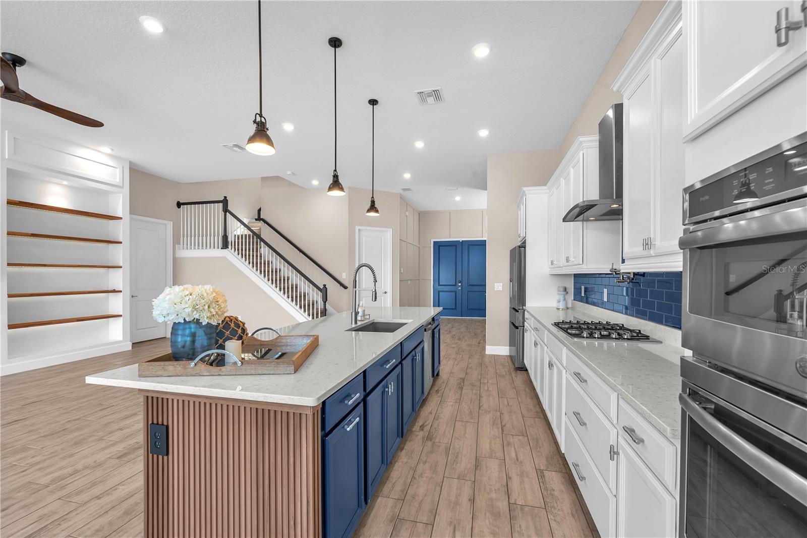 Gas Cook top, built-in convection oven and Microwave and stainless steel sink in the island make cooking a breeze.