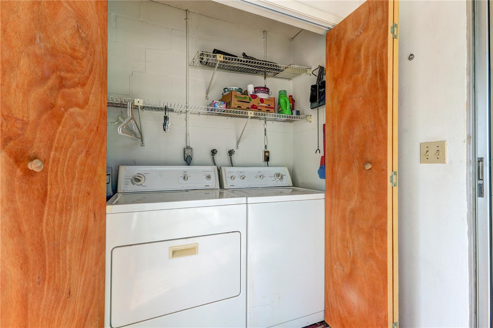 laundry room in the florida room with additional storage