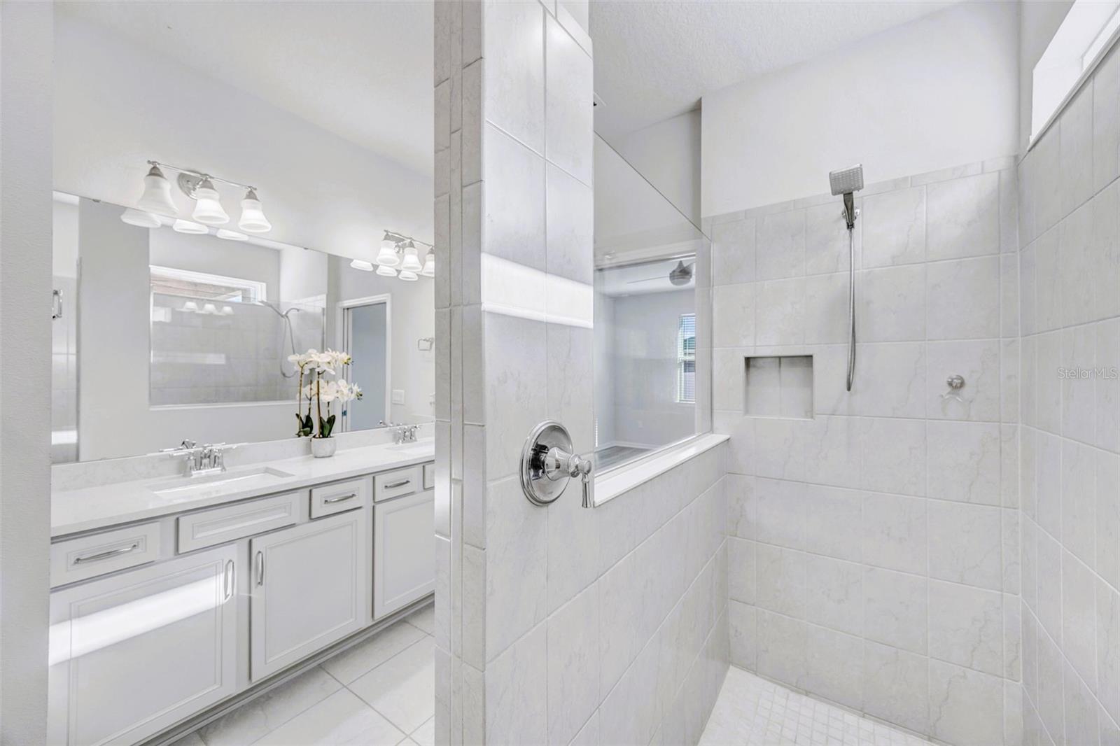 Owner's Tiled, Welk -In Shower with Frameless Glass Enclosure & Niche