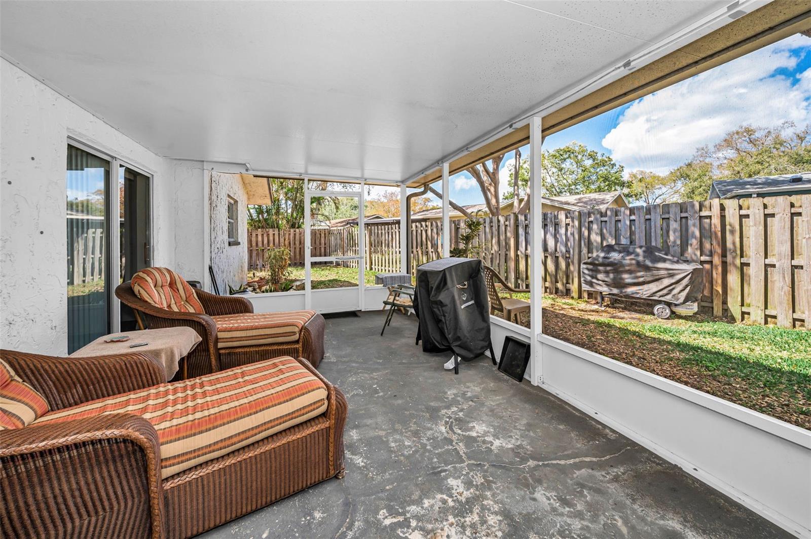 Screened Back patio over looking the fenced backyard