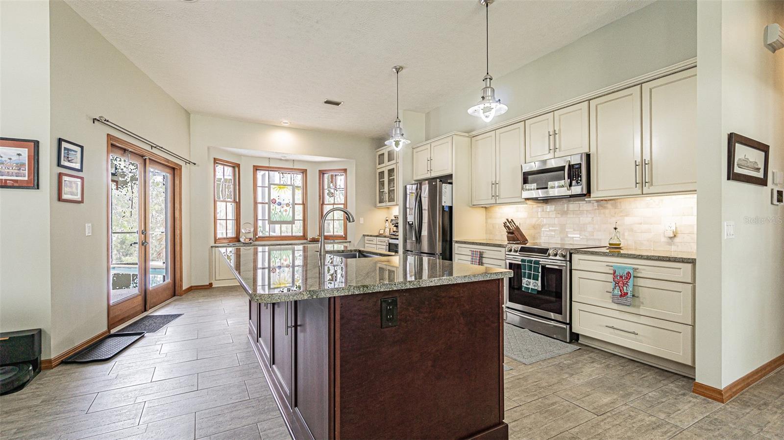 Large open kitchen with huge Island Bar seating space