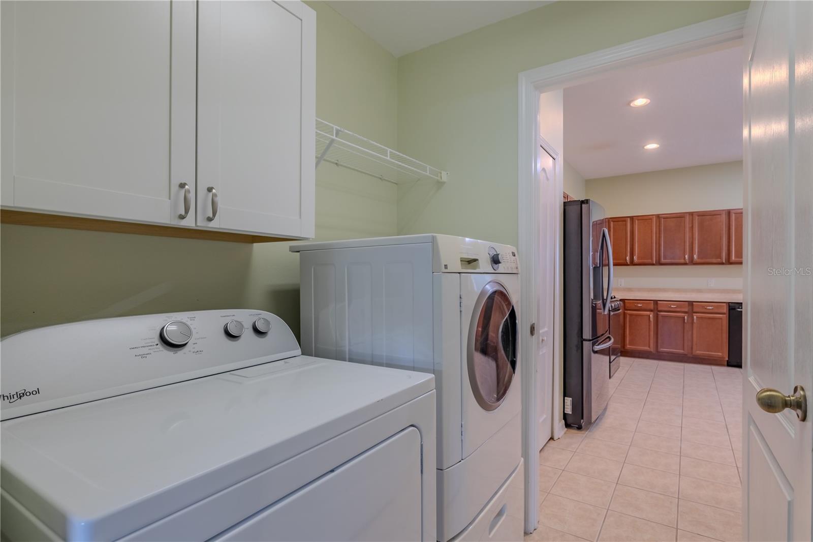 Inside laundry with storage!