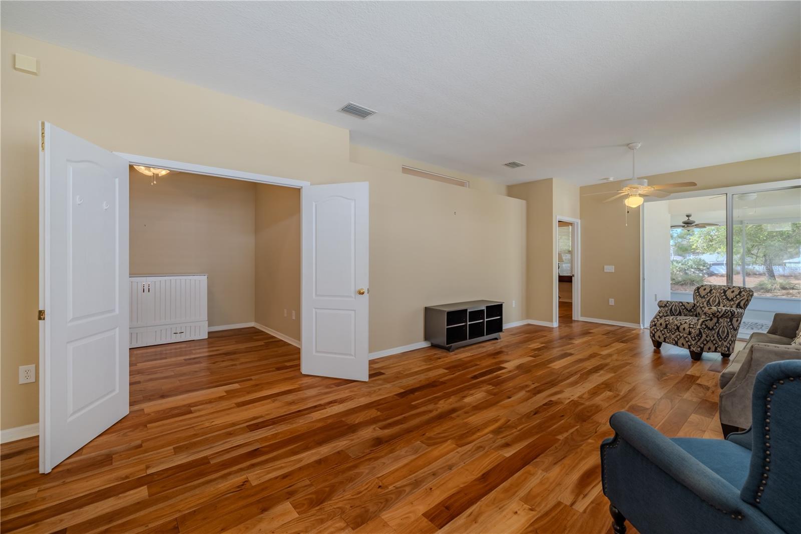 Living room looking towards bonus room with double doors. Murphy bed is negotiable!