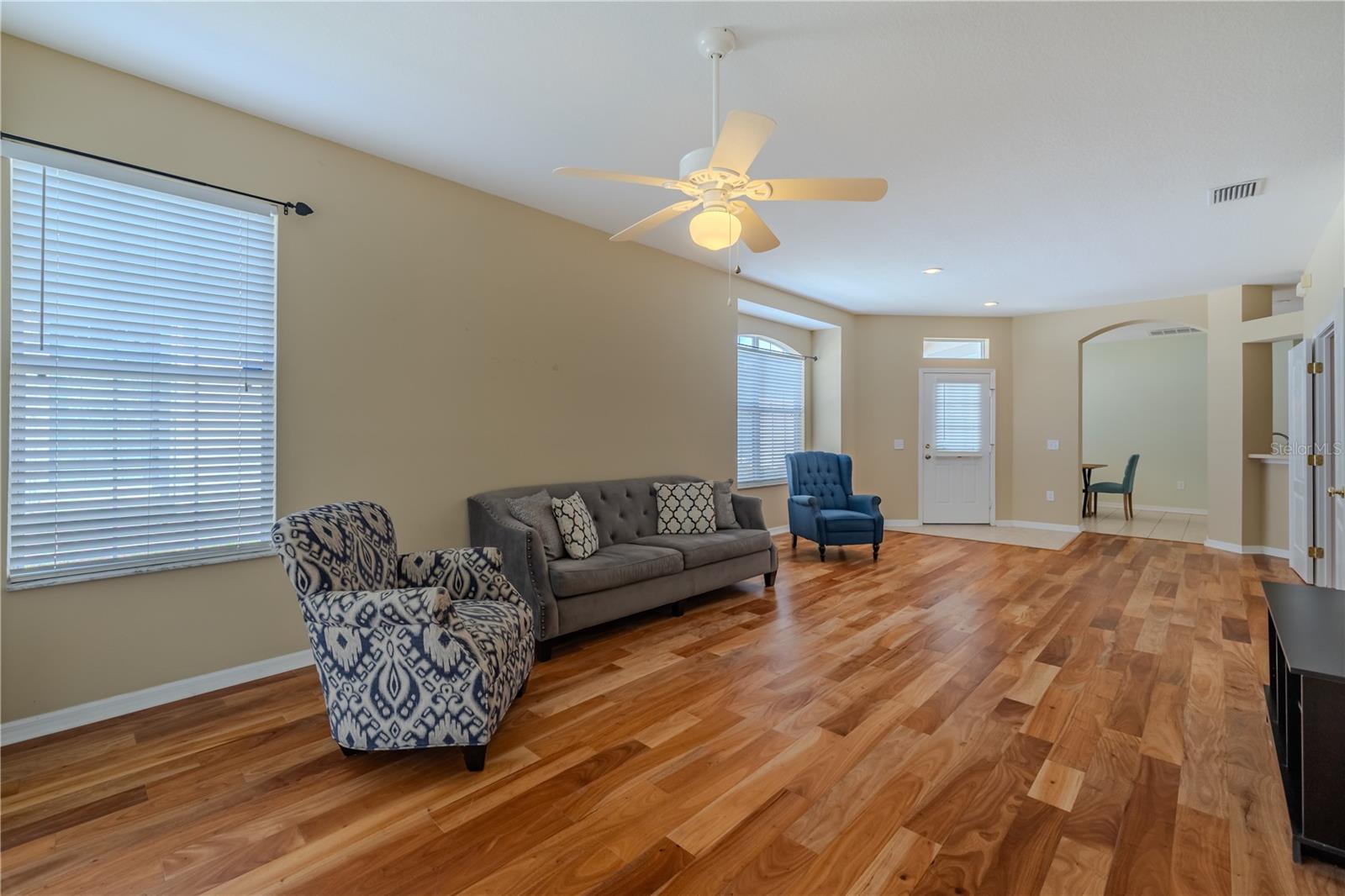 Living room looking towards front door from Primary suite. Furniture is negotiable.