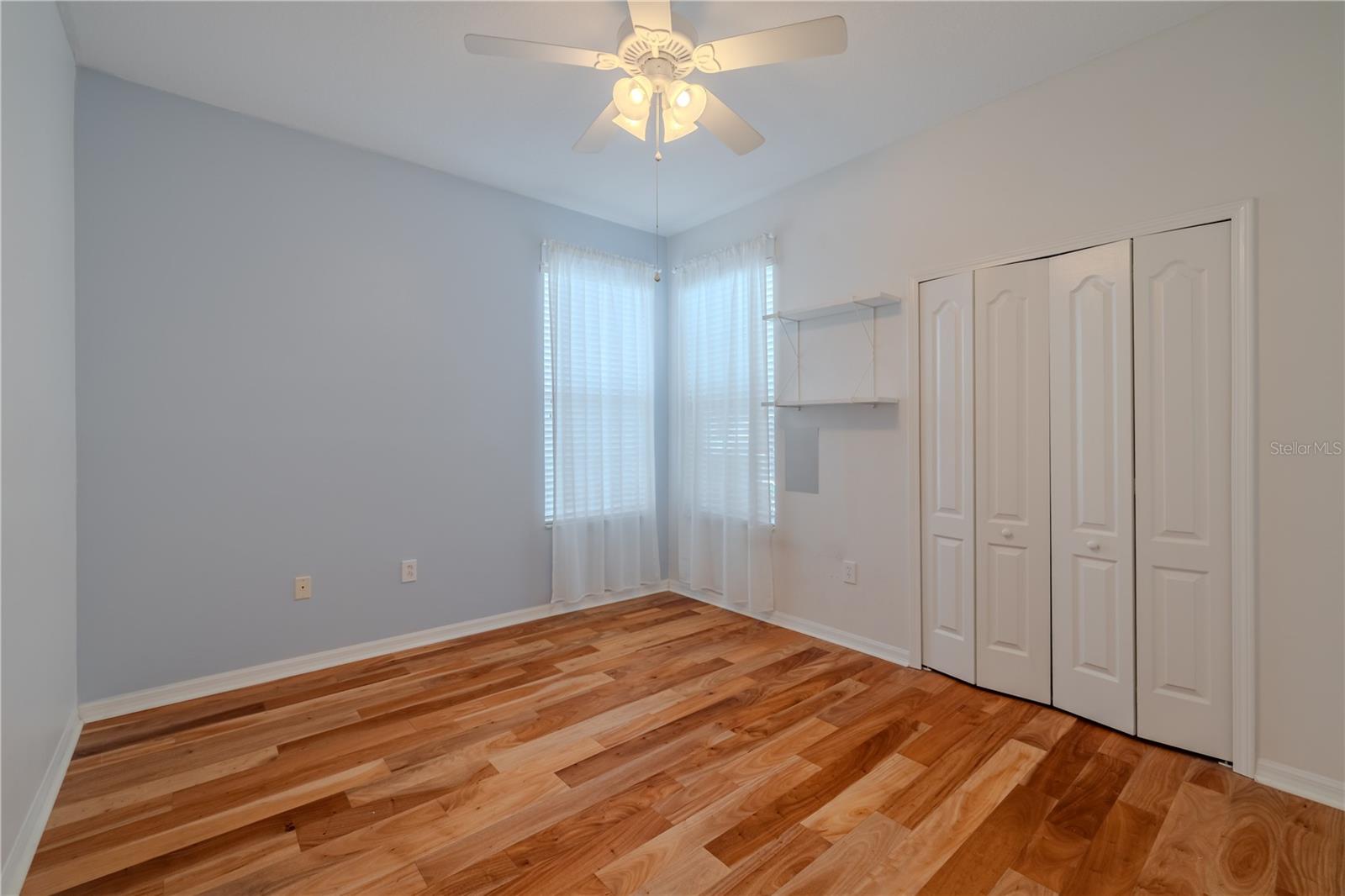 Second bedroom with ceiling fan & California Closet!