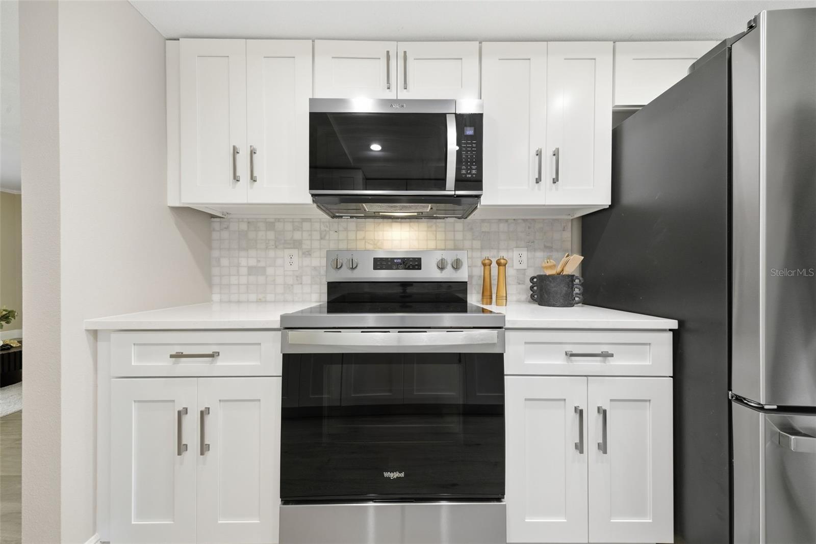 Brand new kitchen with quartz counters.