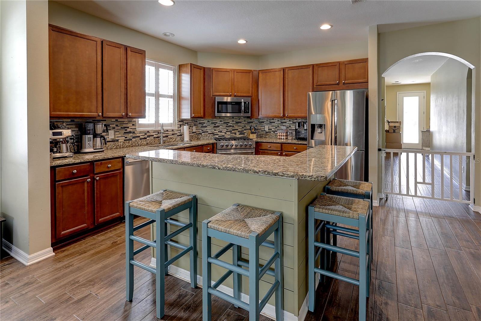 Kitchen and Kitchen Island with Bar Seating