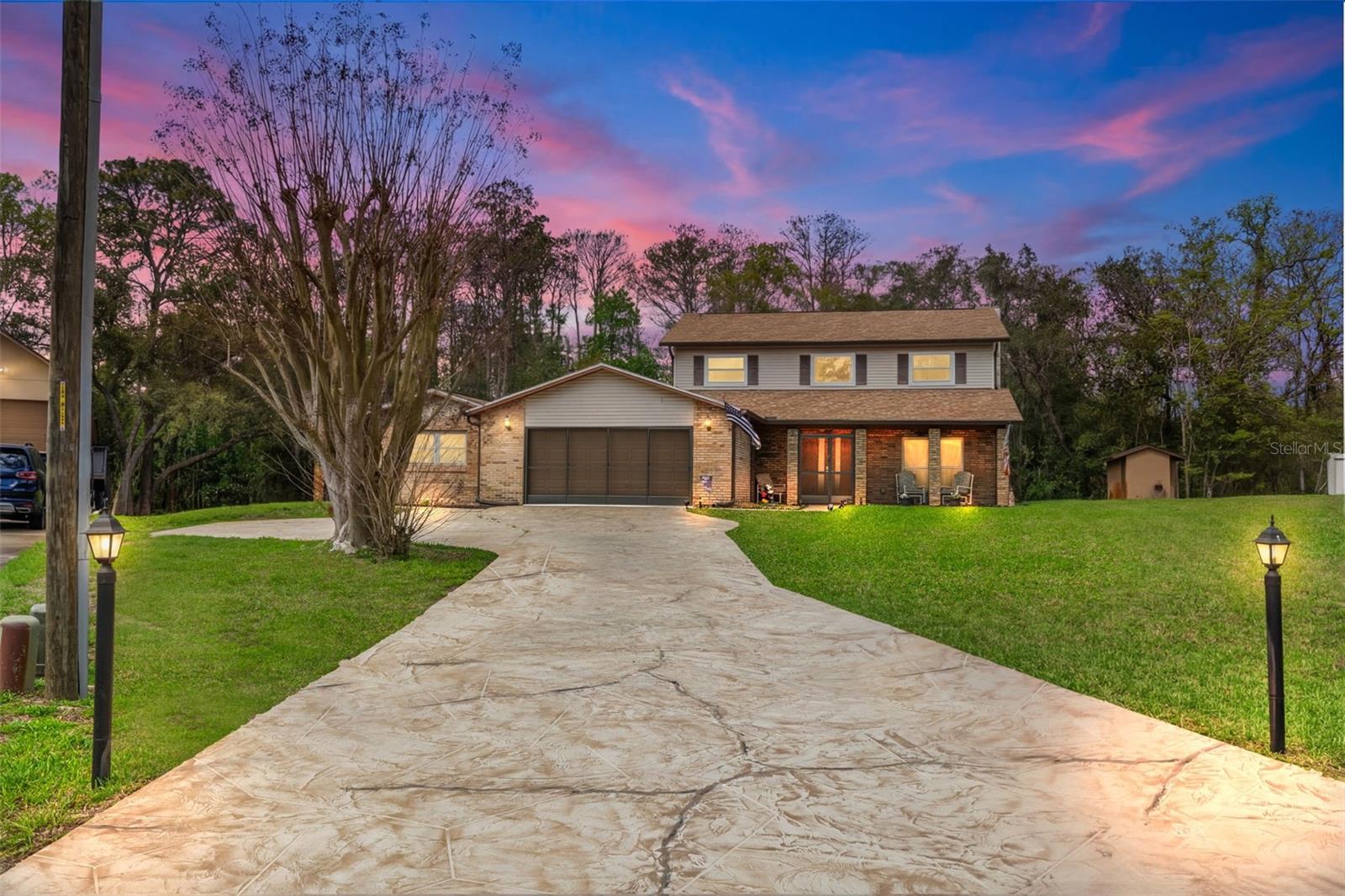 long driveway, extra parking pad, 2 car garage