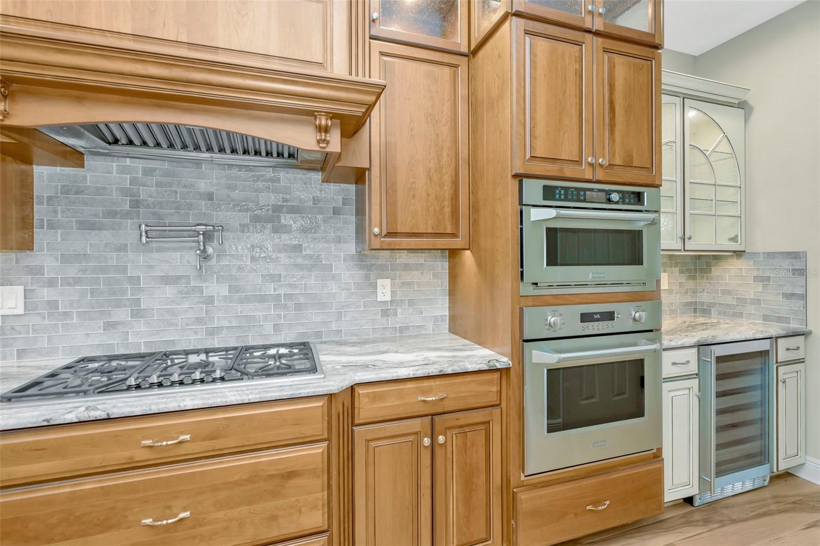 Gas cooktop and double wall convection oven.
