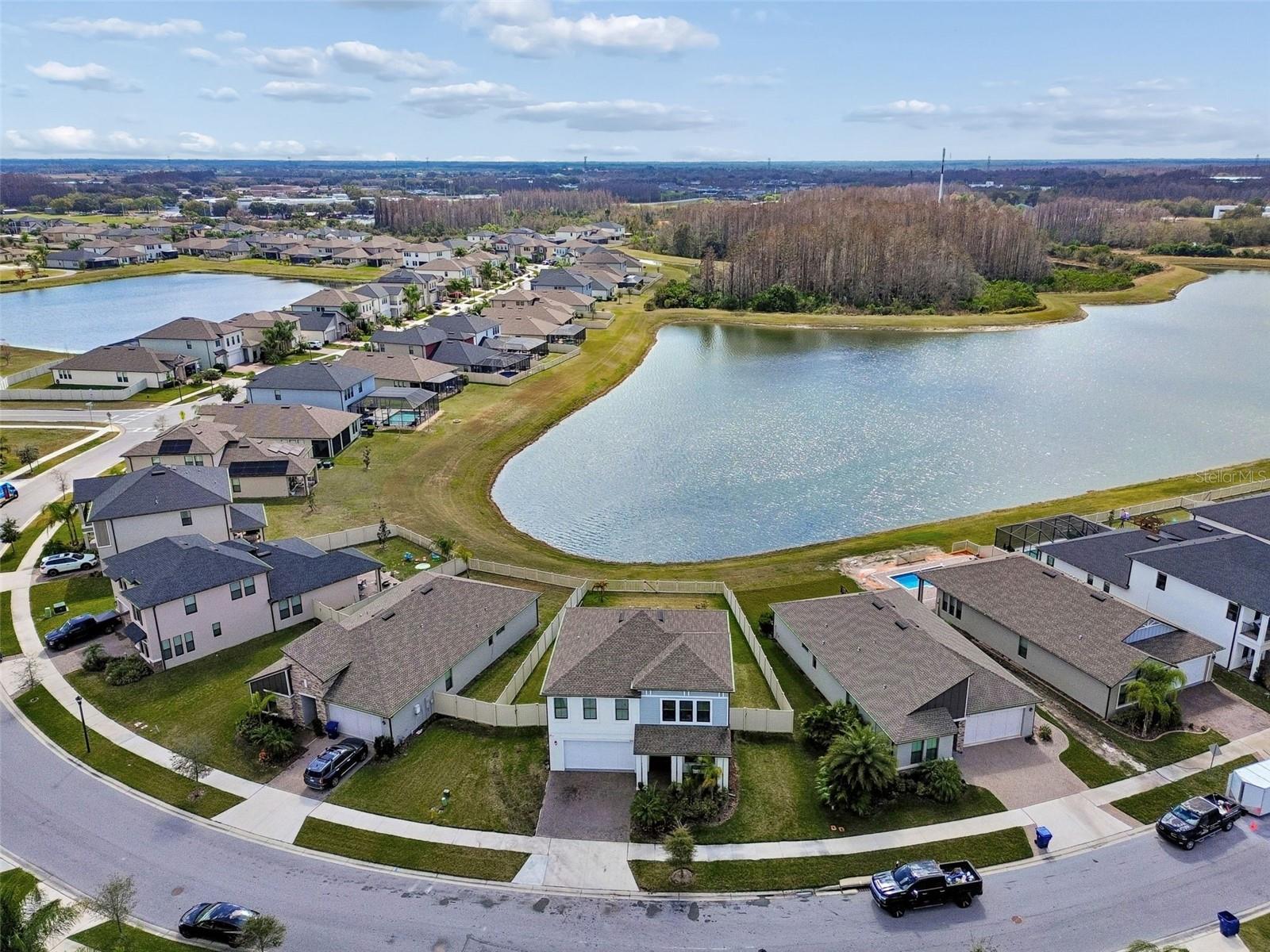 Large backyard facing pond and conservation