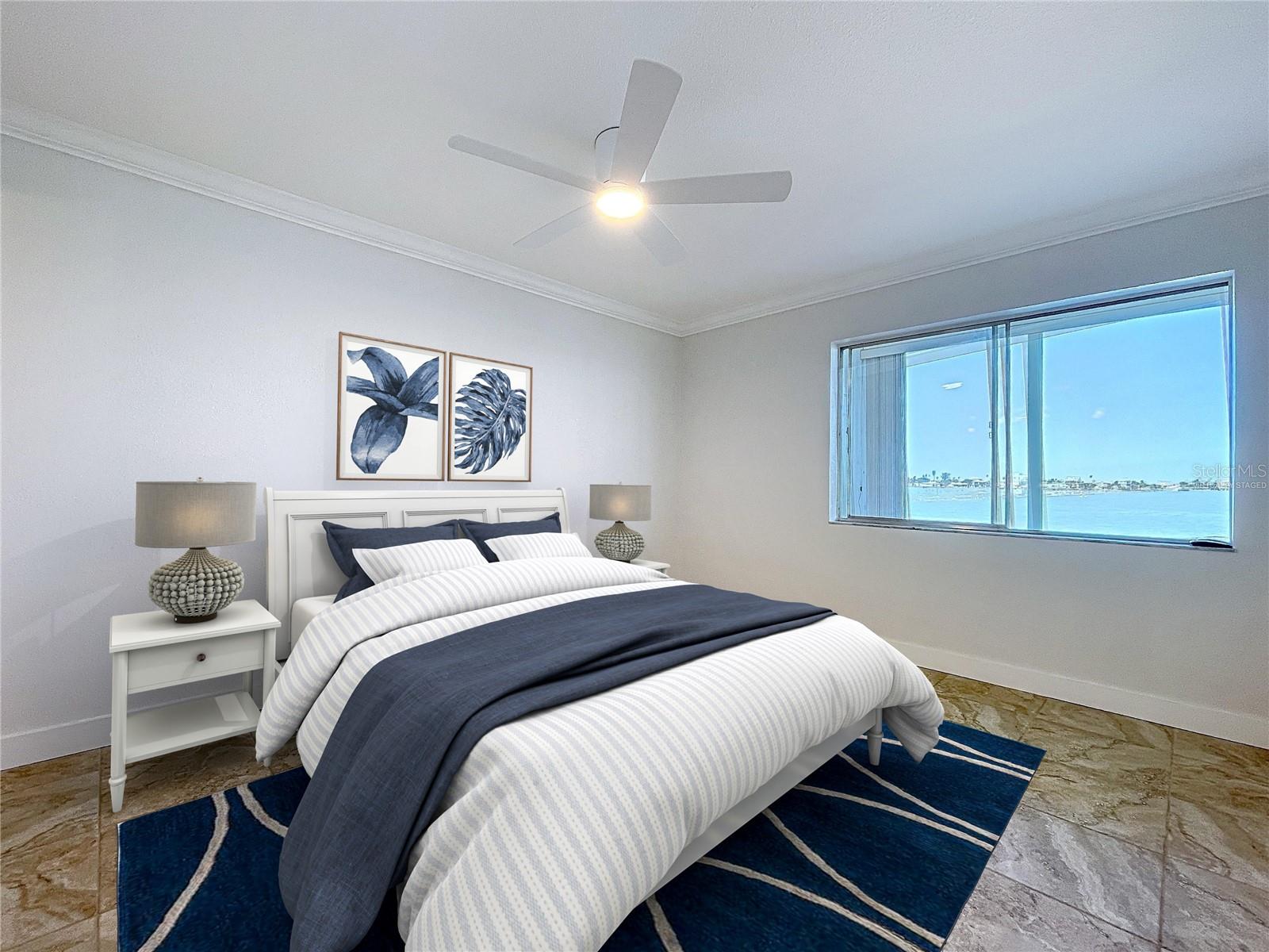 Virtually staged Primary suite offers a water view.