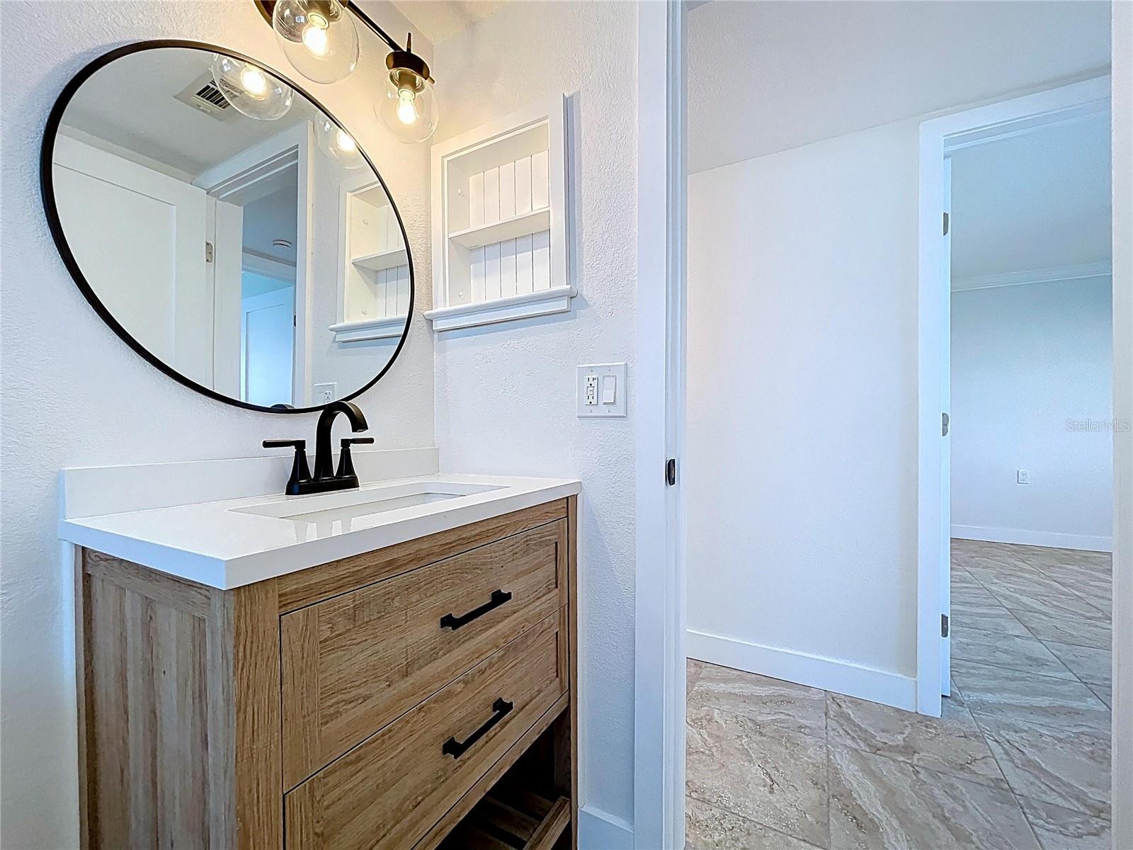 Fully updated guest bathroom with tun and new vanity.