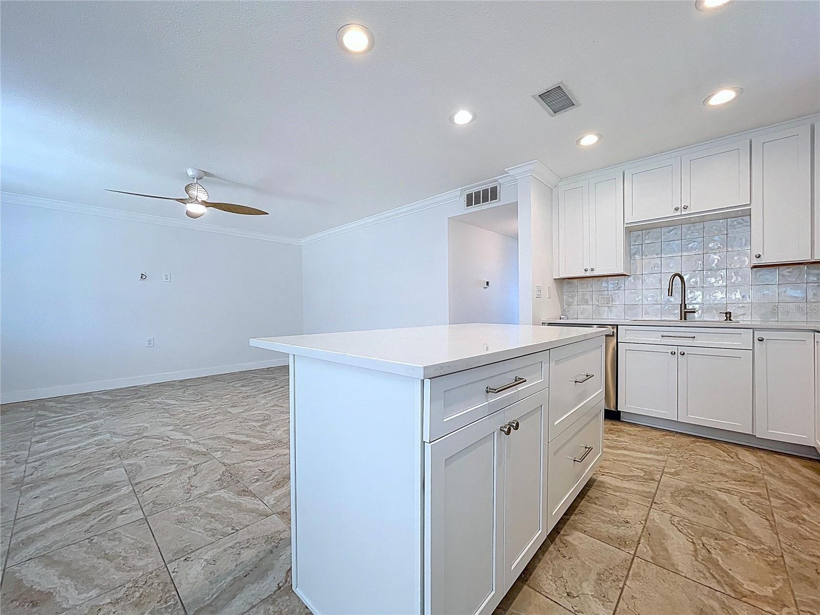 Kitchen island offers additional counter space, storage and bar seating.
