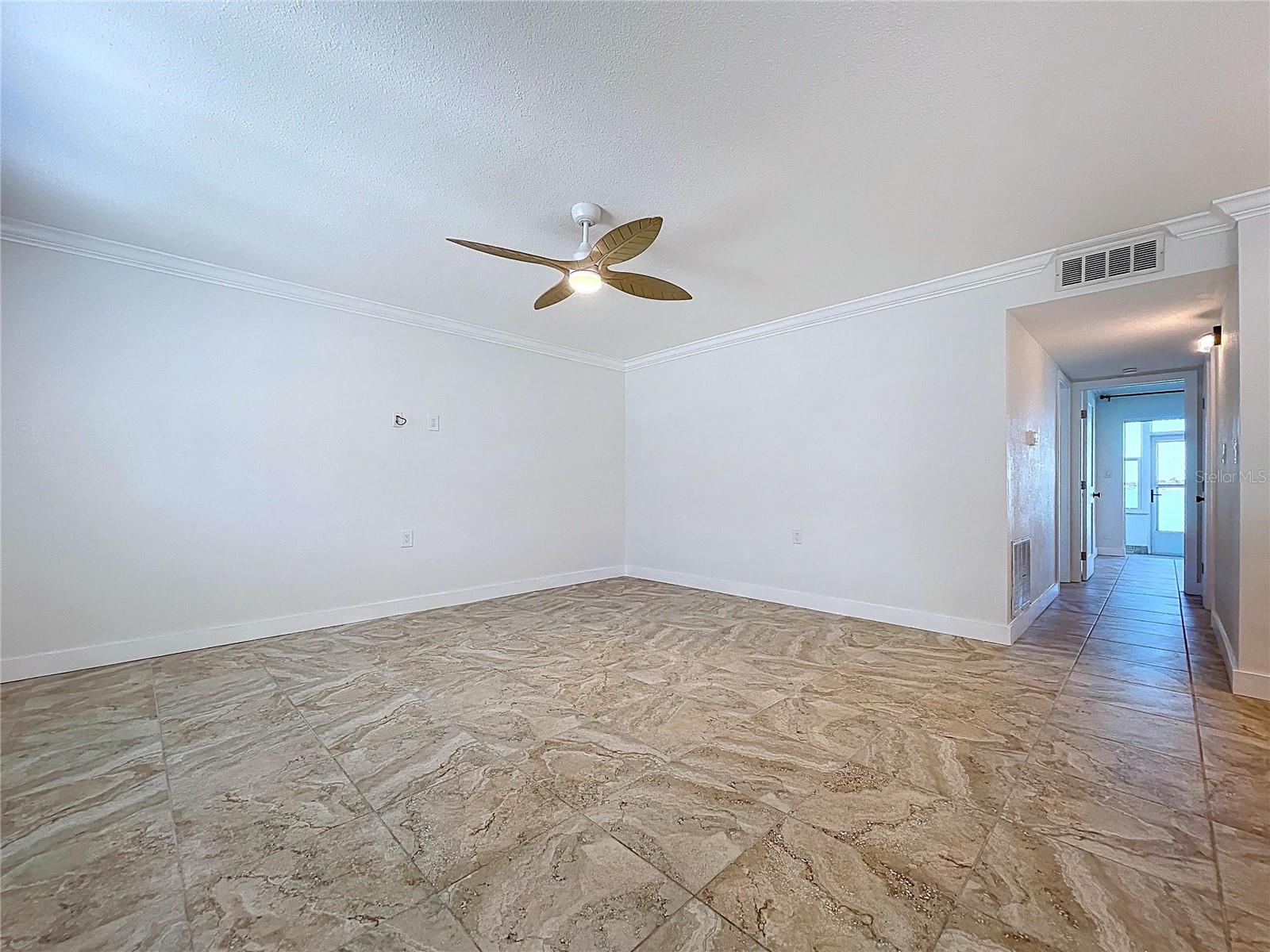 Large living room is inviting and full of natural light.
