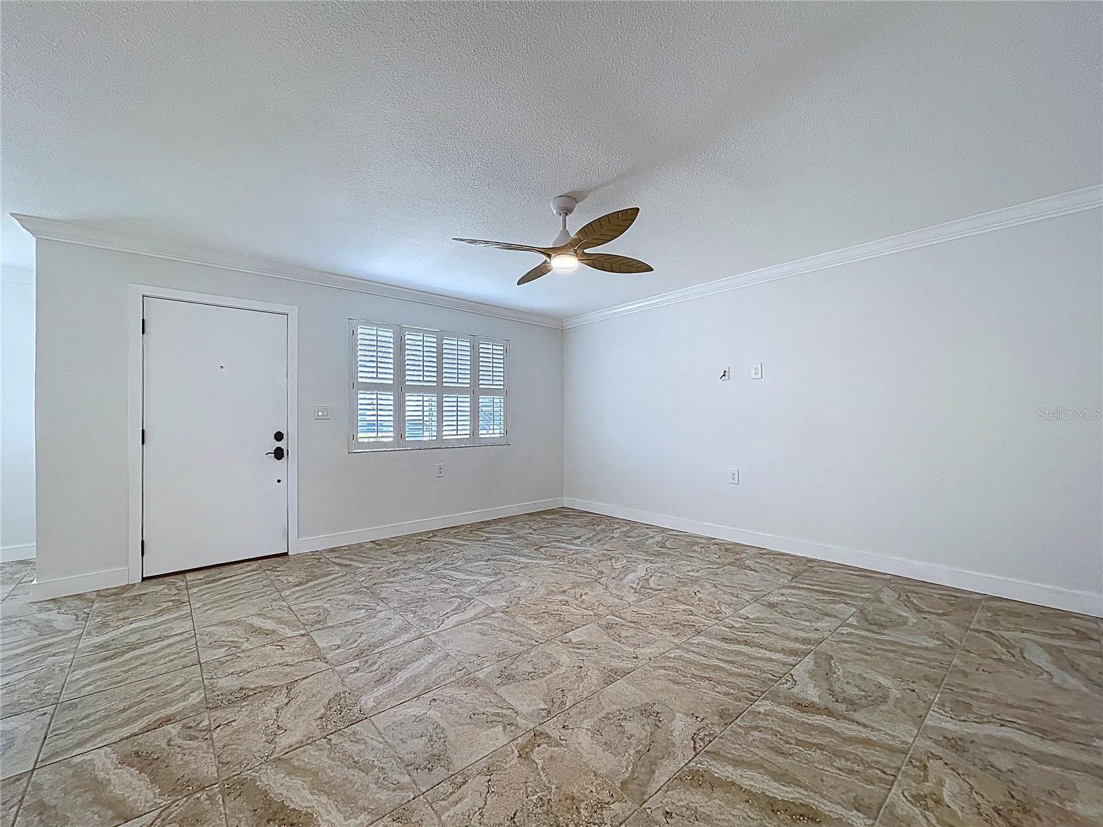 Large living room is inviting and full of natural light.