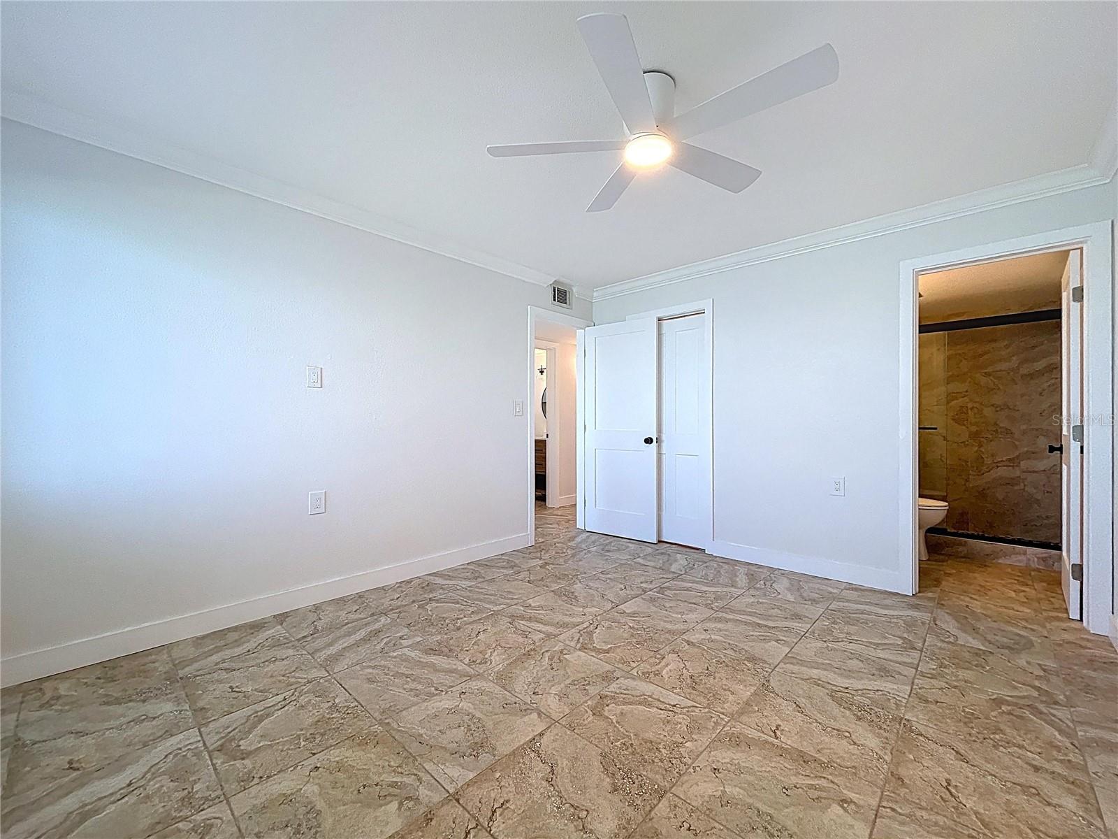 The Primary bedroom offers views of the waterways of John's Pass.