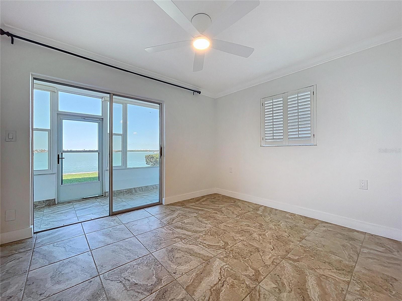 The guest bedroom could be a second living room with water views of John's Pass.
