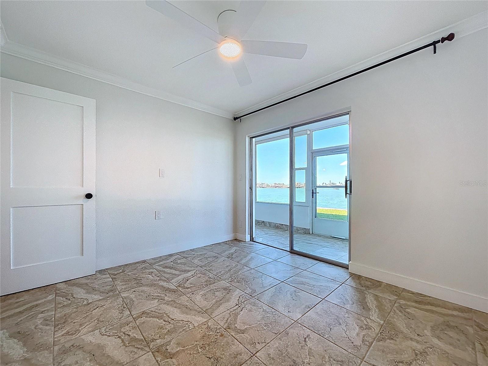 The guest bedroom is a great flex space in this condo.