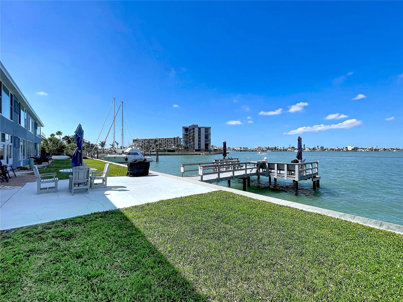 Watch the boats come and go through John's Pass.