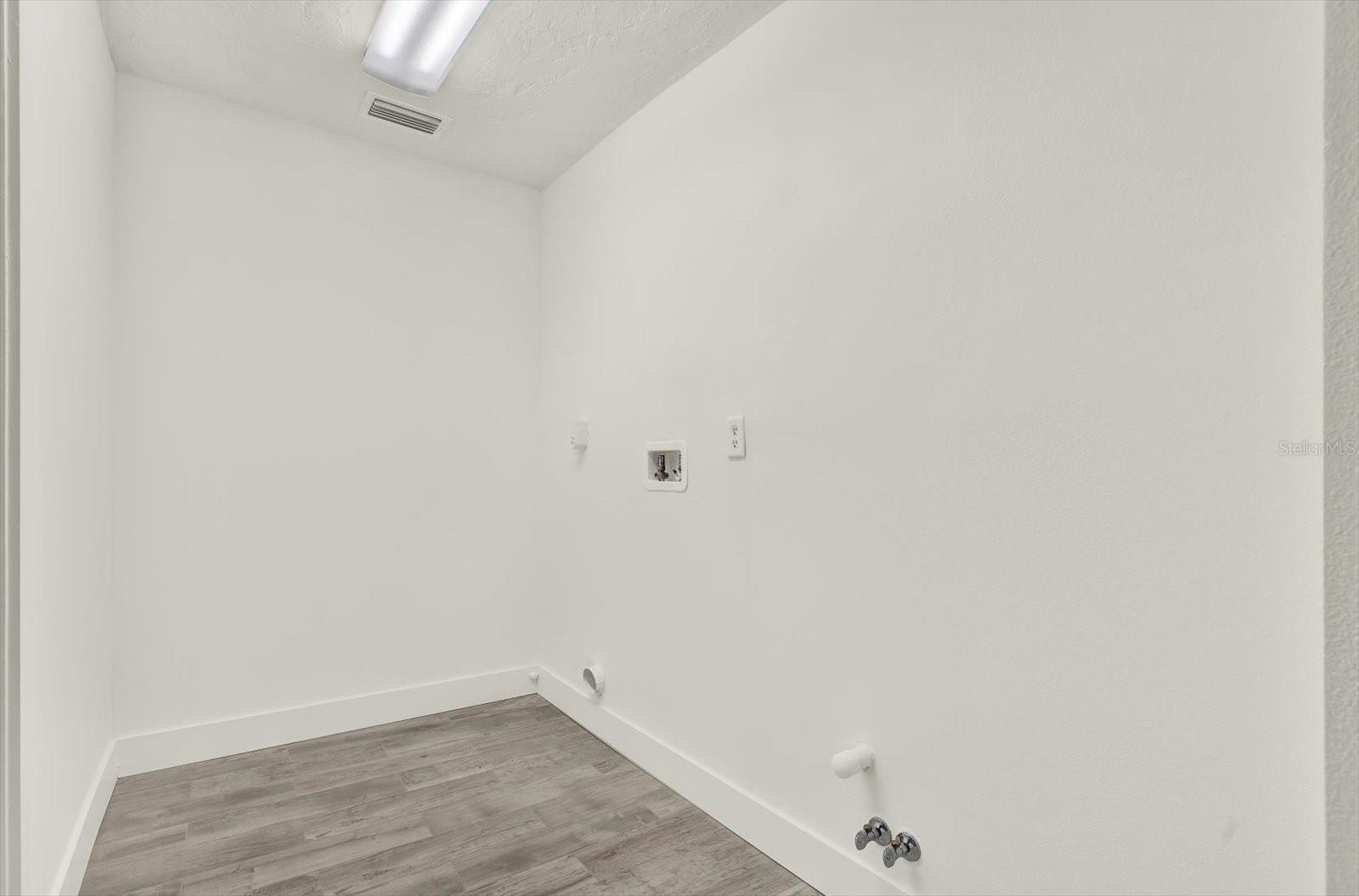 Inside seperate Laundry Room