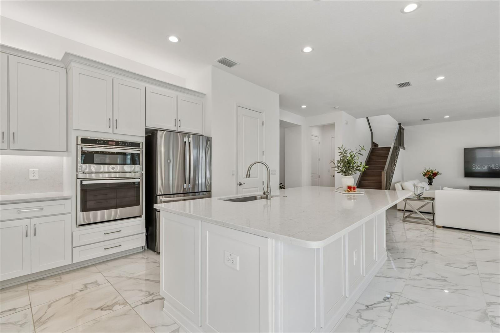 Continuation of chef's kitchen featuring the built-in oven/microwave combination.