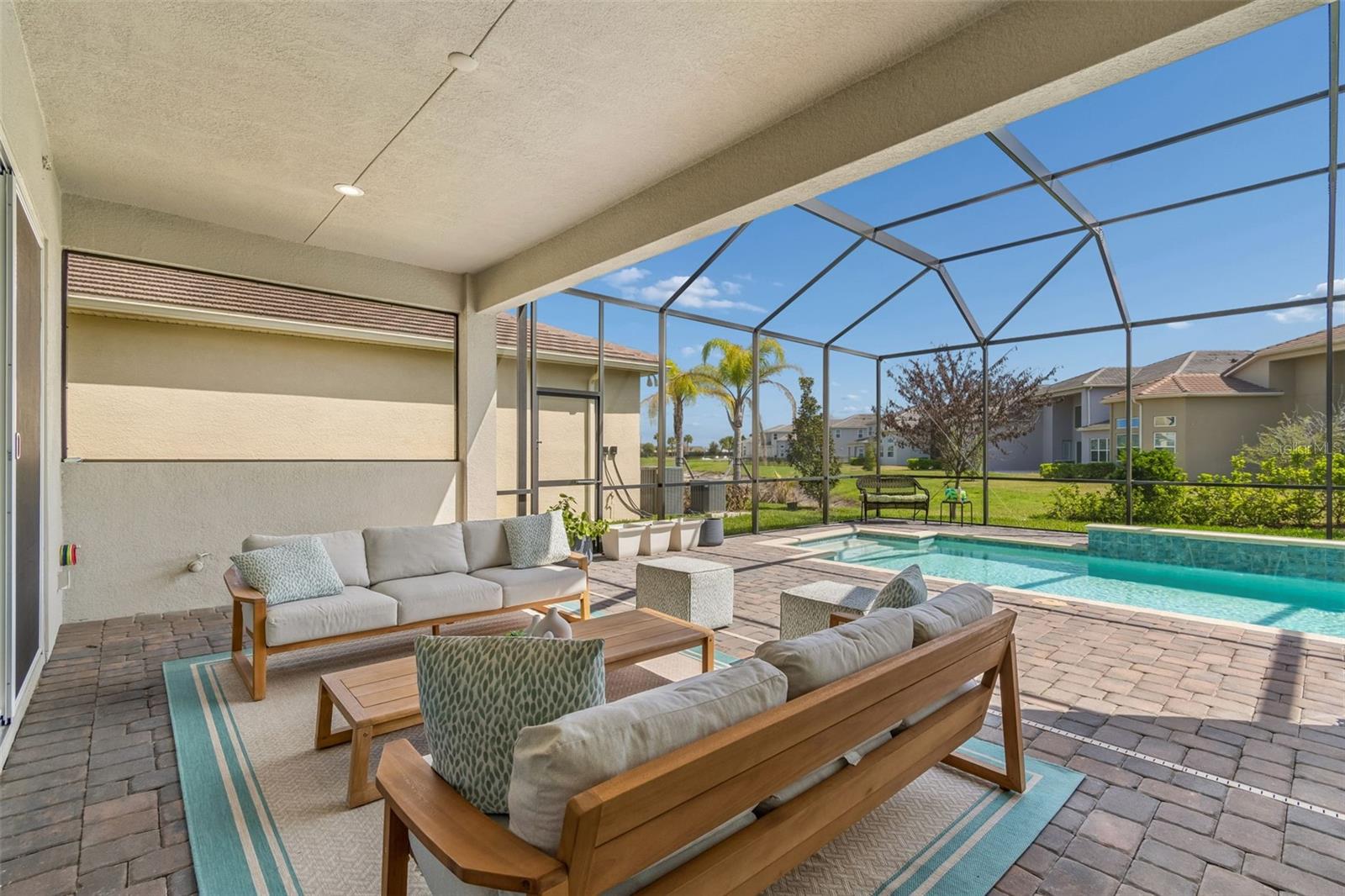 Enjoy coffee or cocktails on your patio...and dream of your desired outdoor kitchen on the wall behind...Notice the stub-outs for electrical and plumbing?