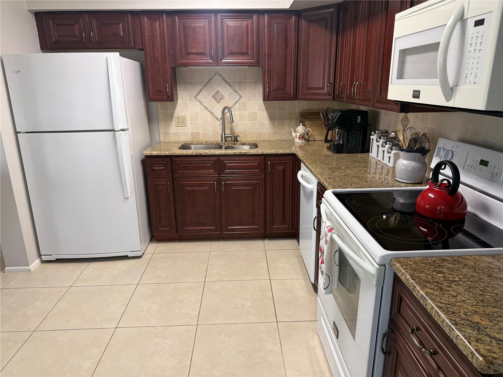 Granite countertops with tiled backsplash