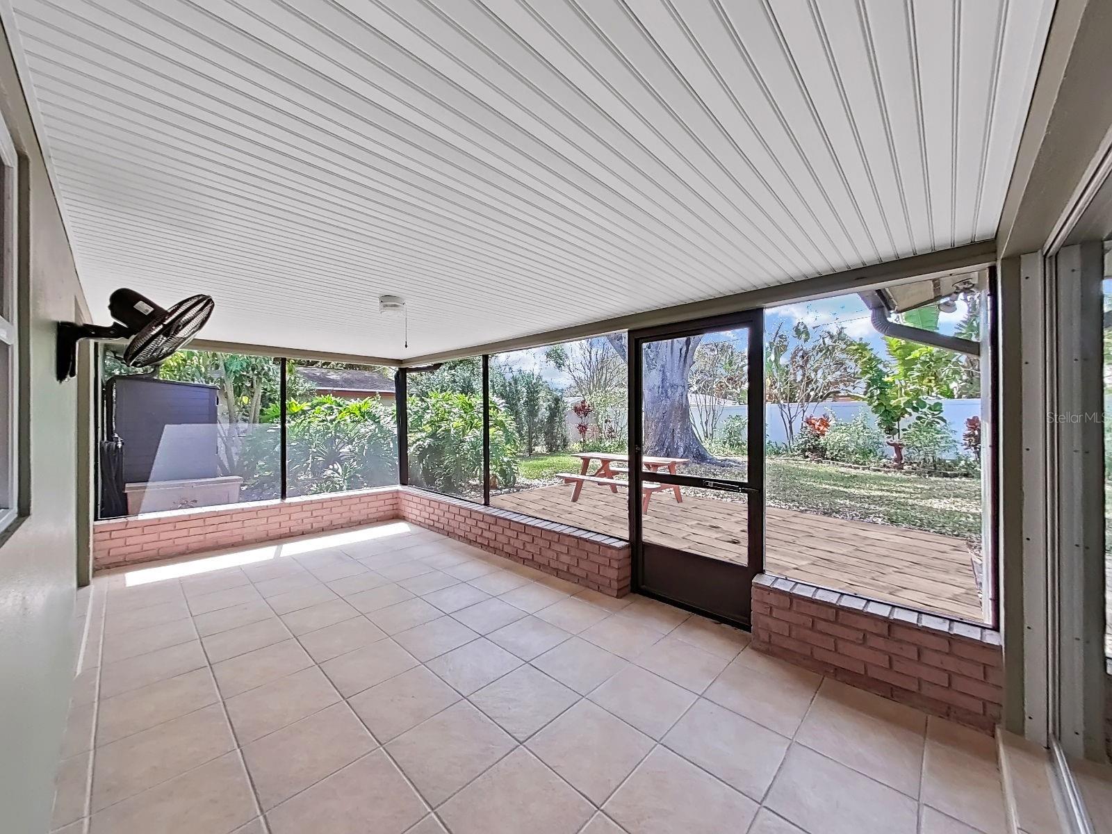 Catch a breeze on your light-filled screened Lanai, which overlooks the great backyard!