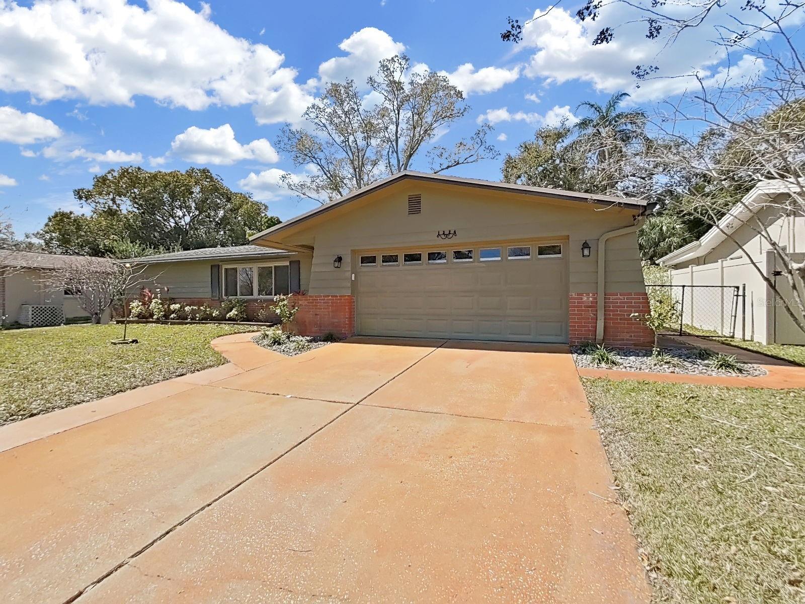 Large driveway for easily parking multiple cars and accessing the oversized 2-Car Garage.