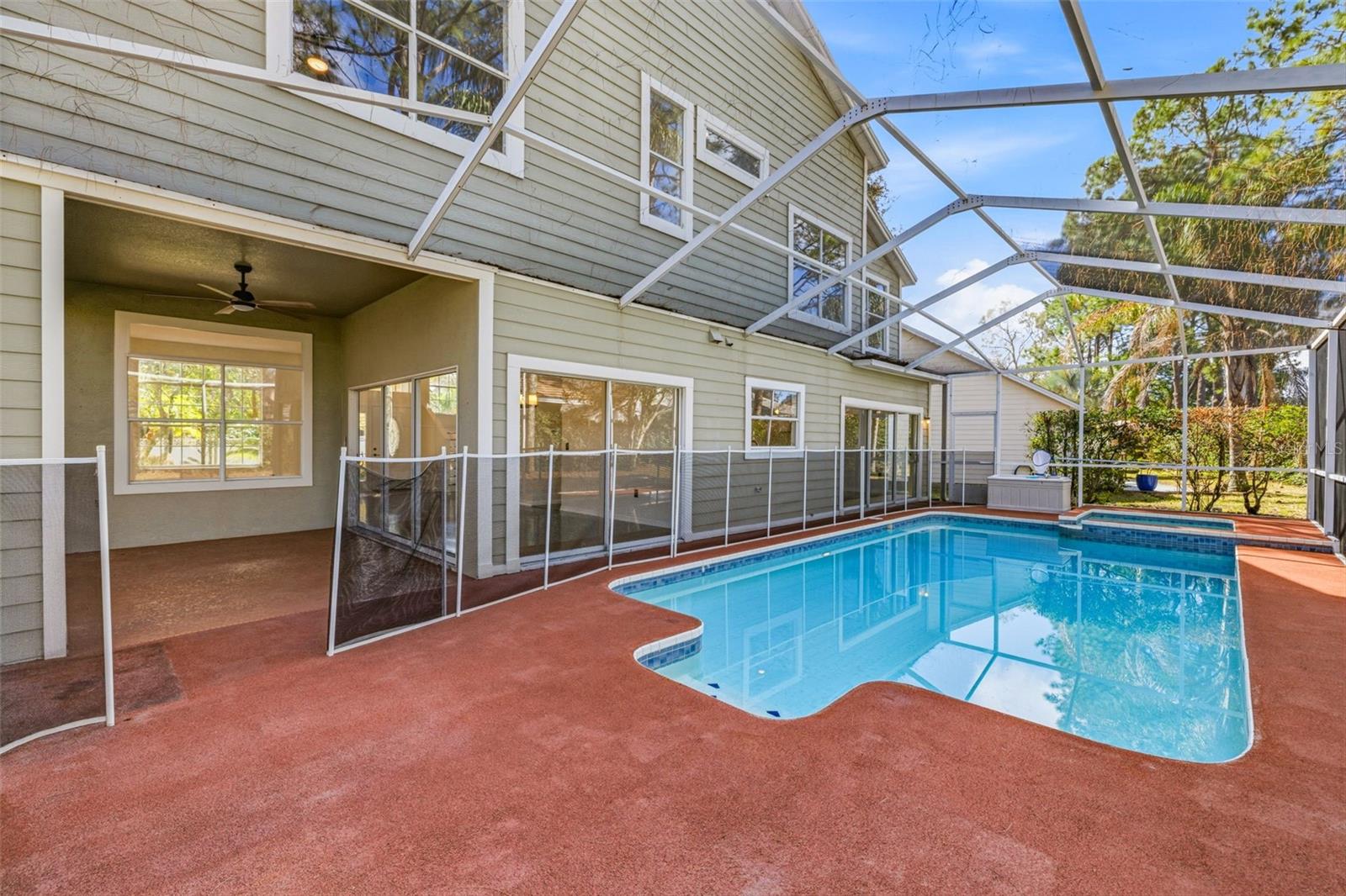 Screened deck with heated pool and spa