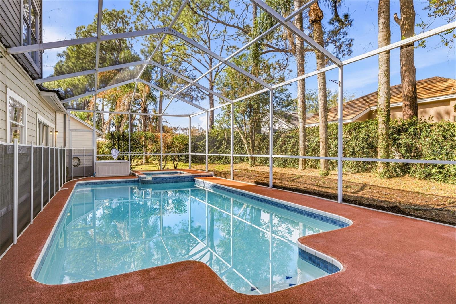 Screened deck with heated pool and spa