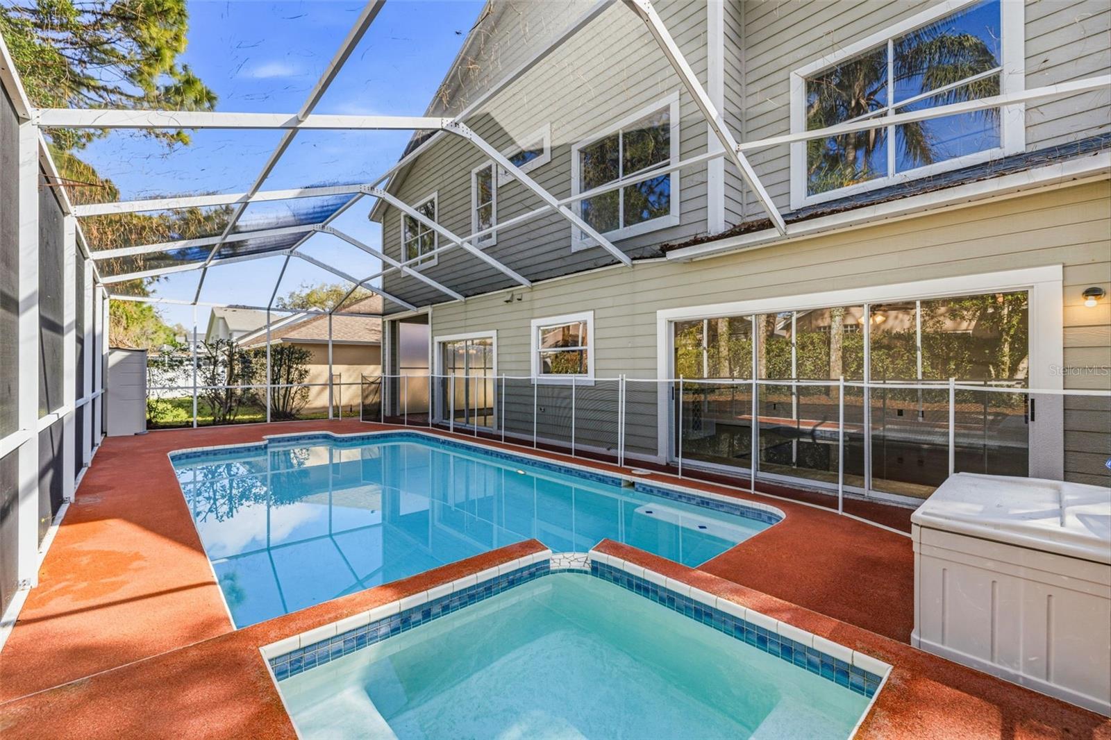 Screened deck with heated pool and spa