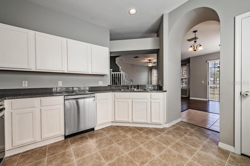 Kitchen, granite counter tops, tile flooring, lots of light.