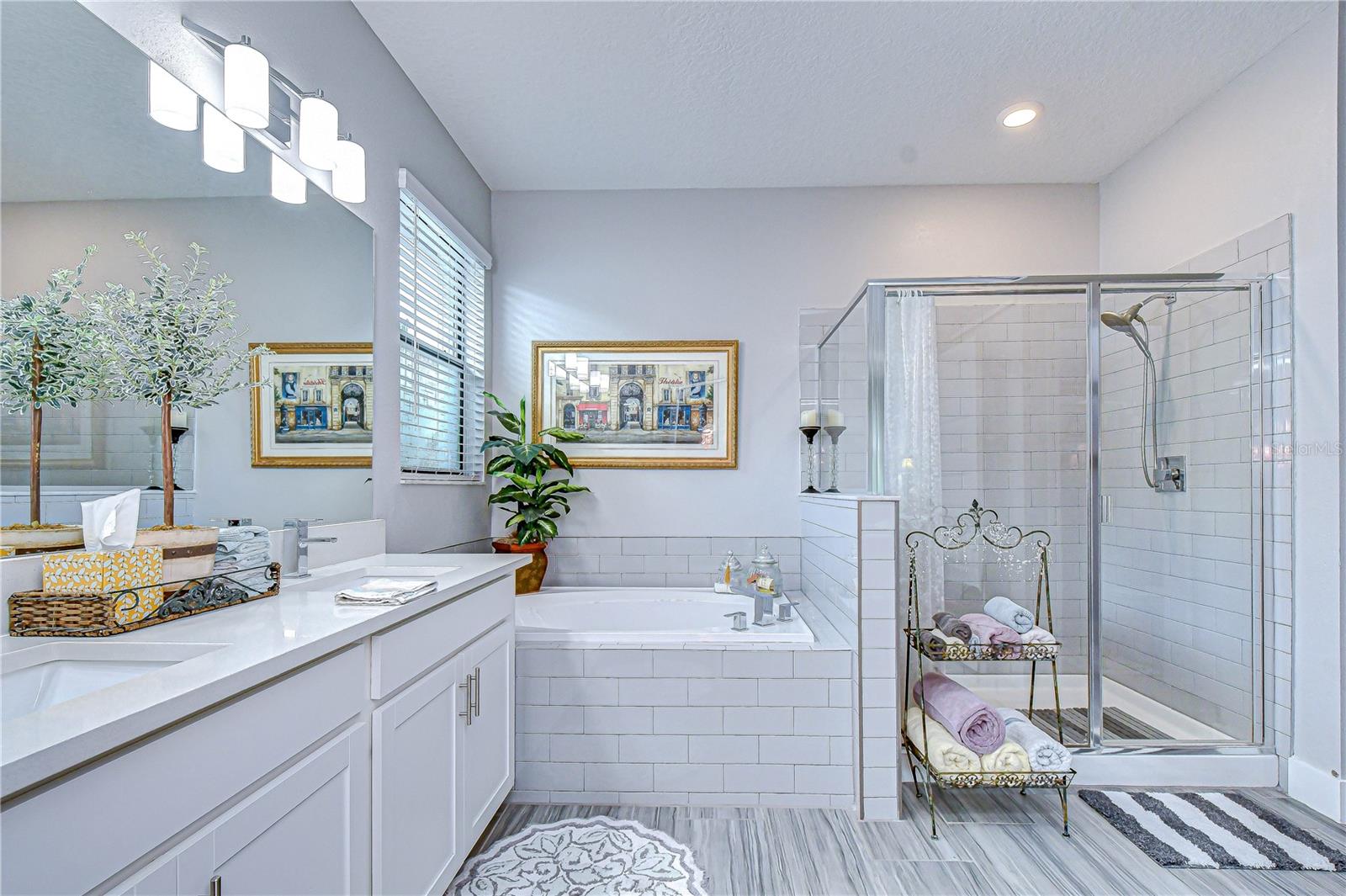 Large walk-in shower paired with a relaxing soaking tub.