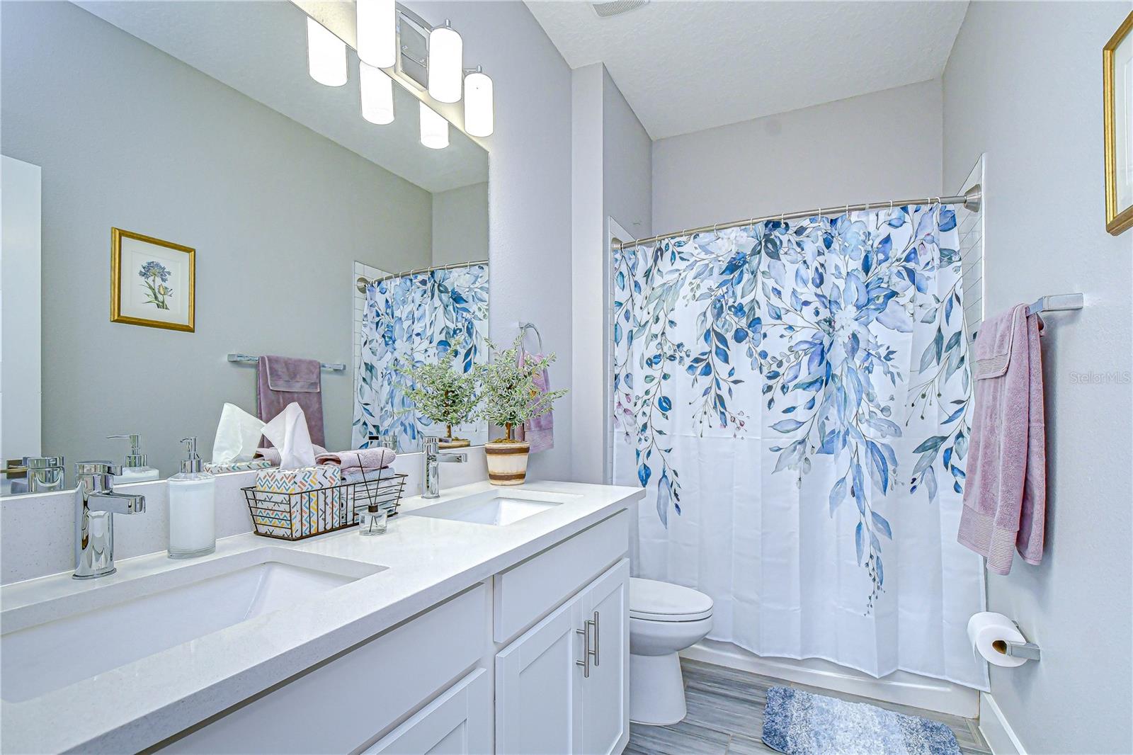 Secondary full bathroom providing convenience for guests and family.
