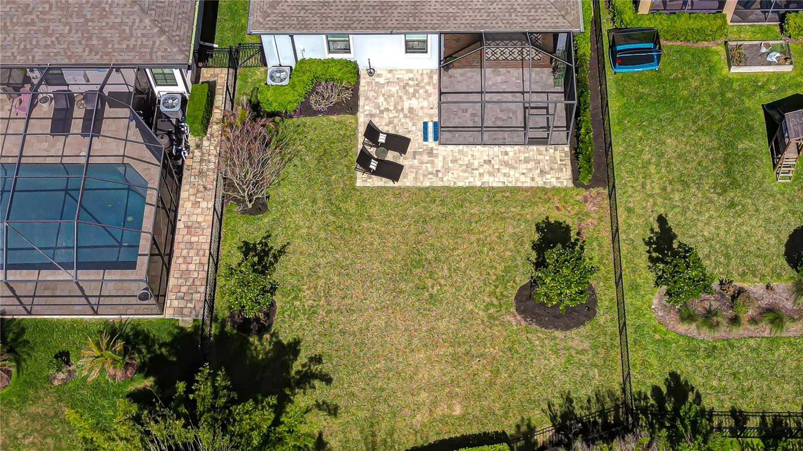 Serene backyard setting with protected conservation land behind the home.