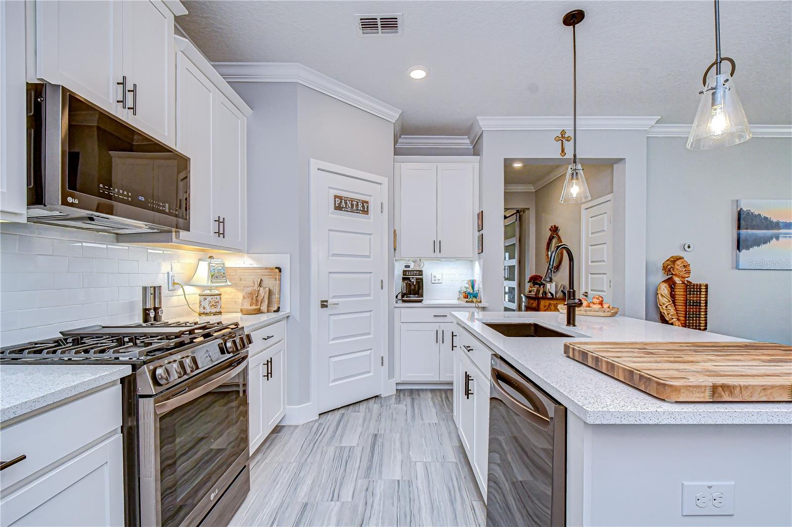 Stainless LG appliances including a gas stove and oven.