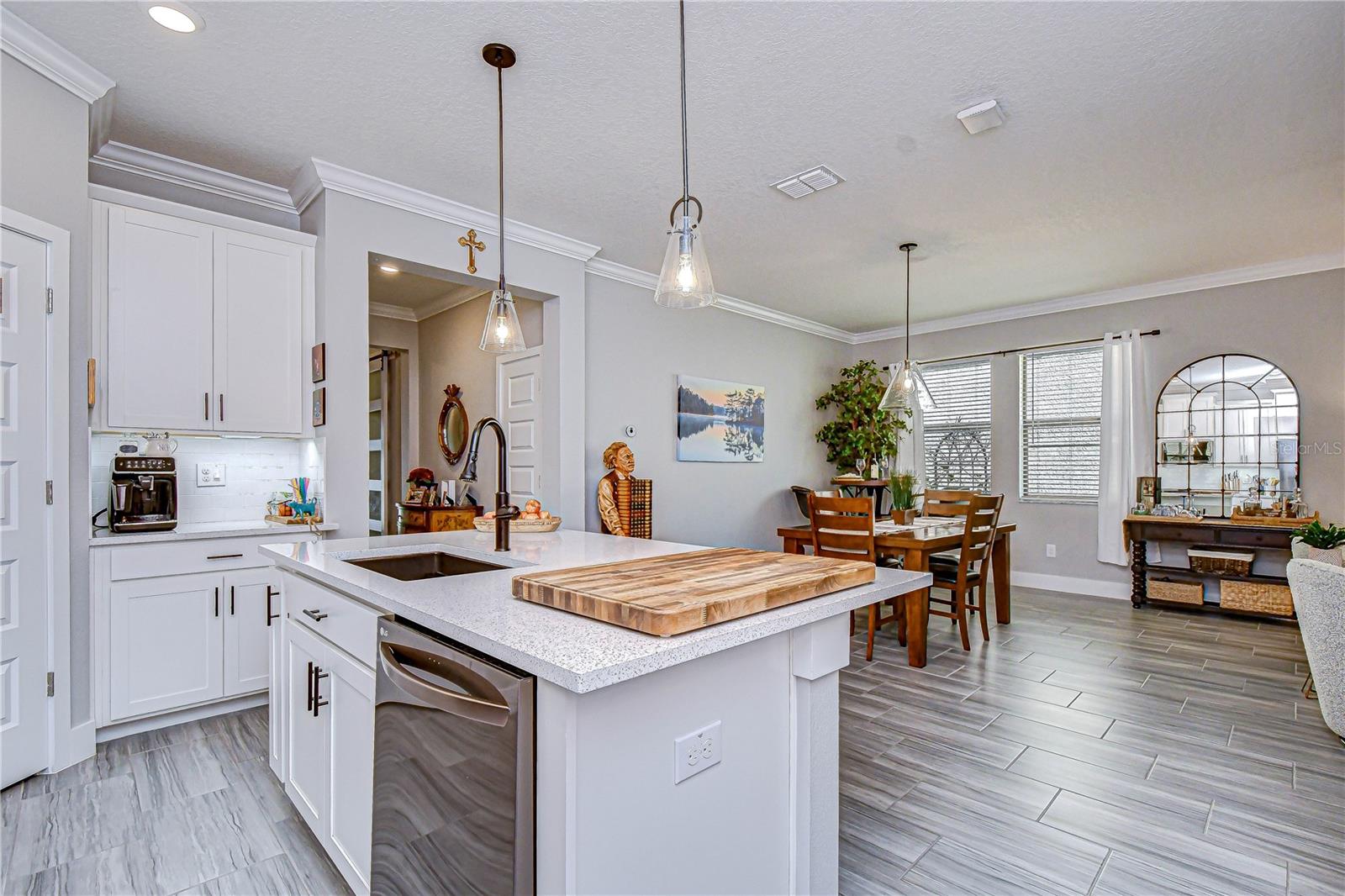 Seamless connection between kitchen, dining, and family room.