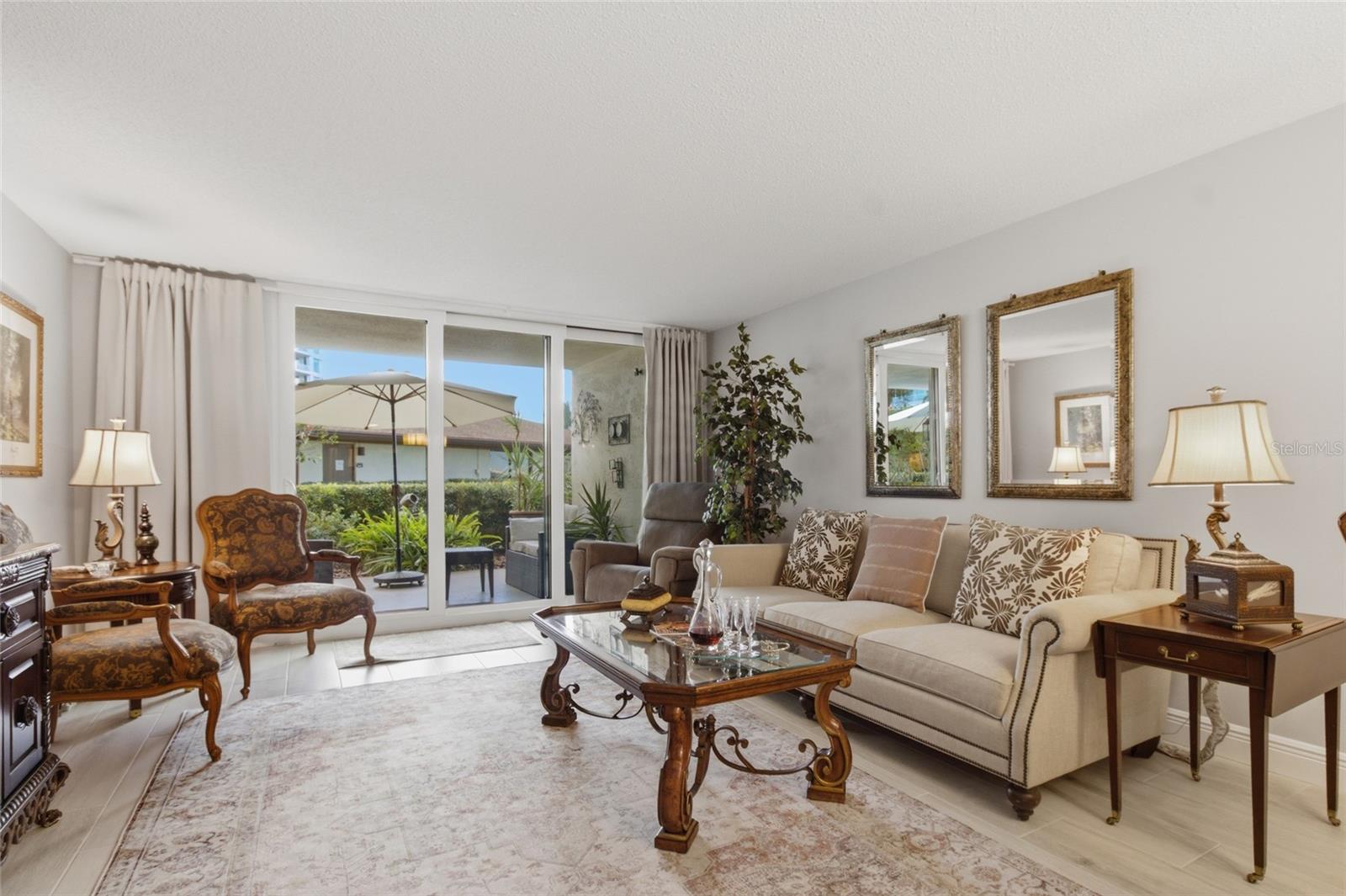 Living Room with gorgeous new sliders to patio with white interior and Lip!