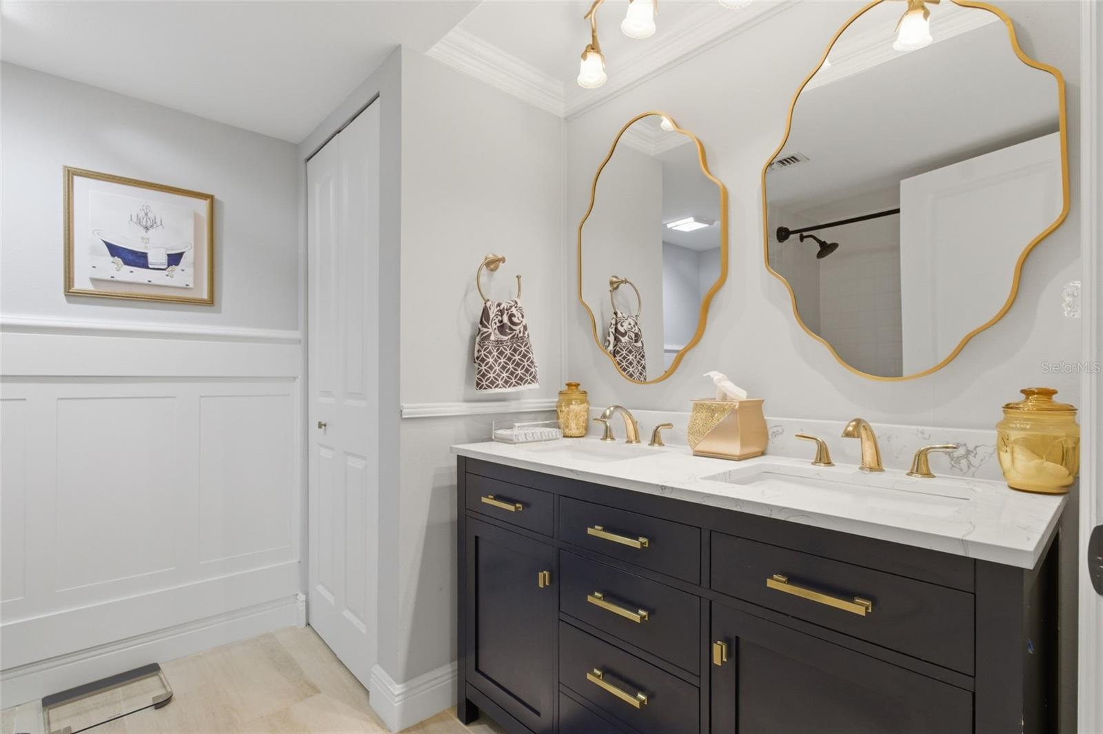 Primary Ensuite Bath/shower combo, Wainscotting, linen closet and dual vanity