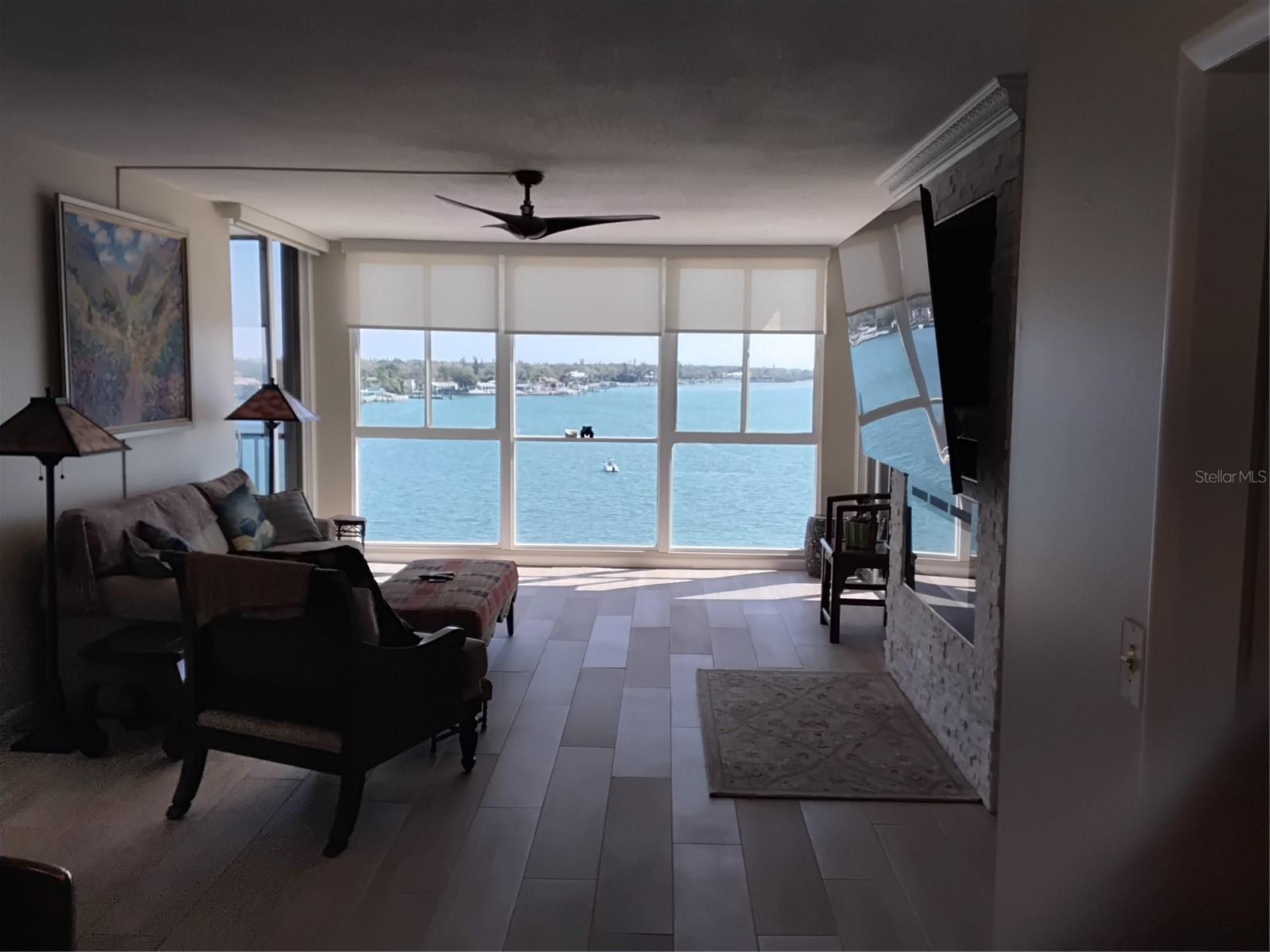 Livingroom with Floor to ceiling windows  and electric fireplace