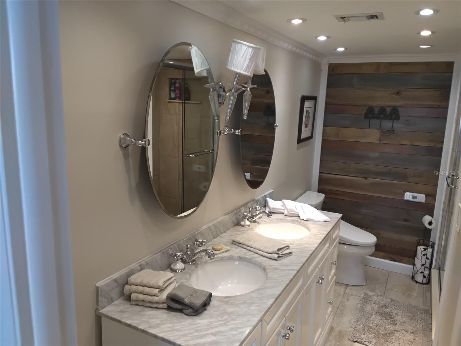 Primary dual sinks/ mirrors , auto flush toilet