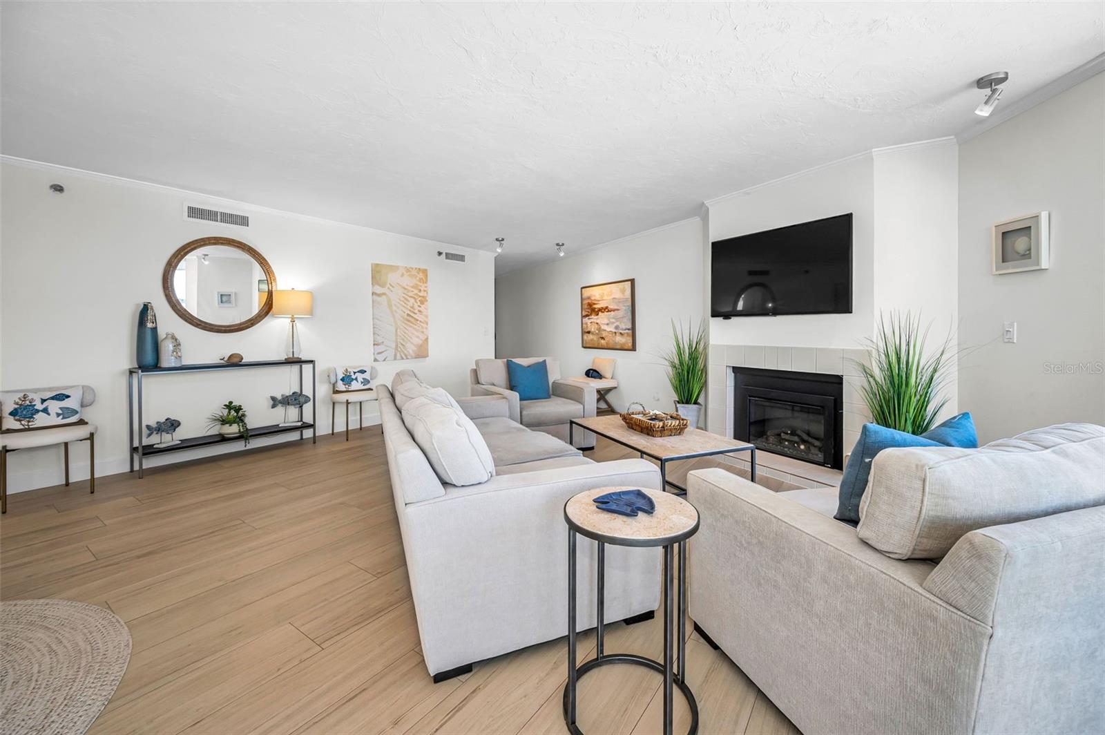 The Living Room / Grand Salon with a fireplace as its anchor