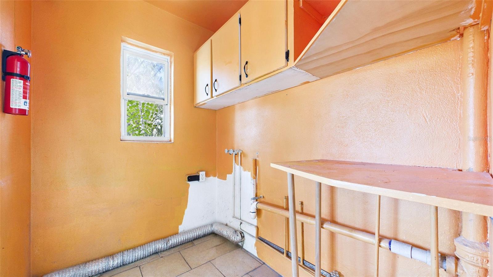 Indoor laundry space off of kitchen