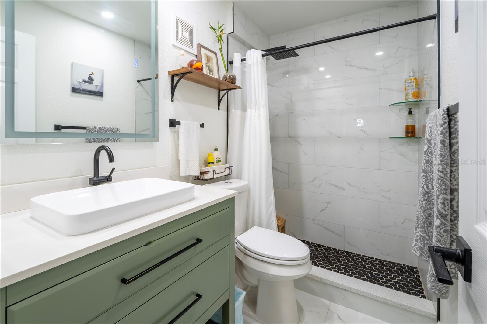 Tastefully finished bathroom with quality fixtures and custom touches
