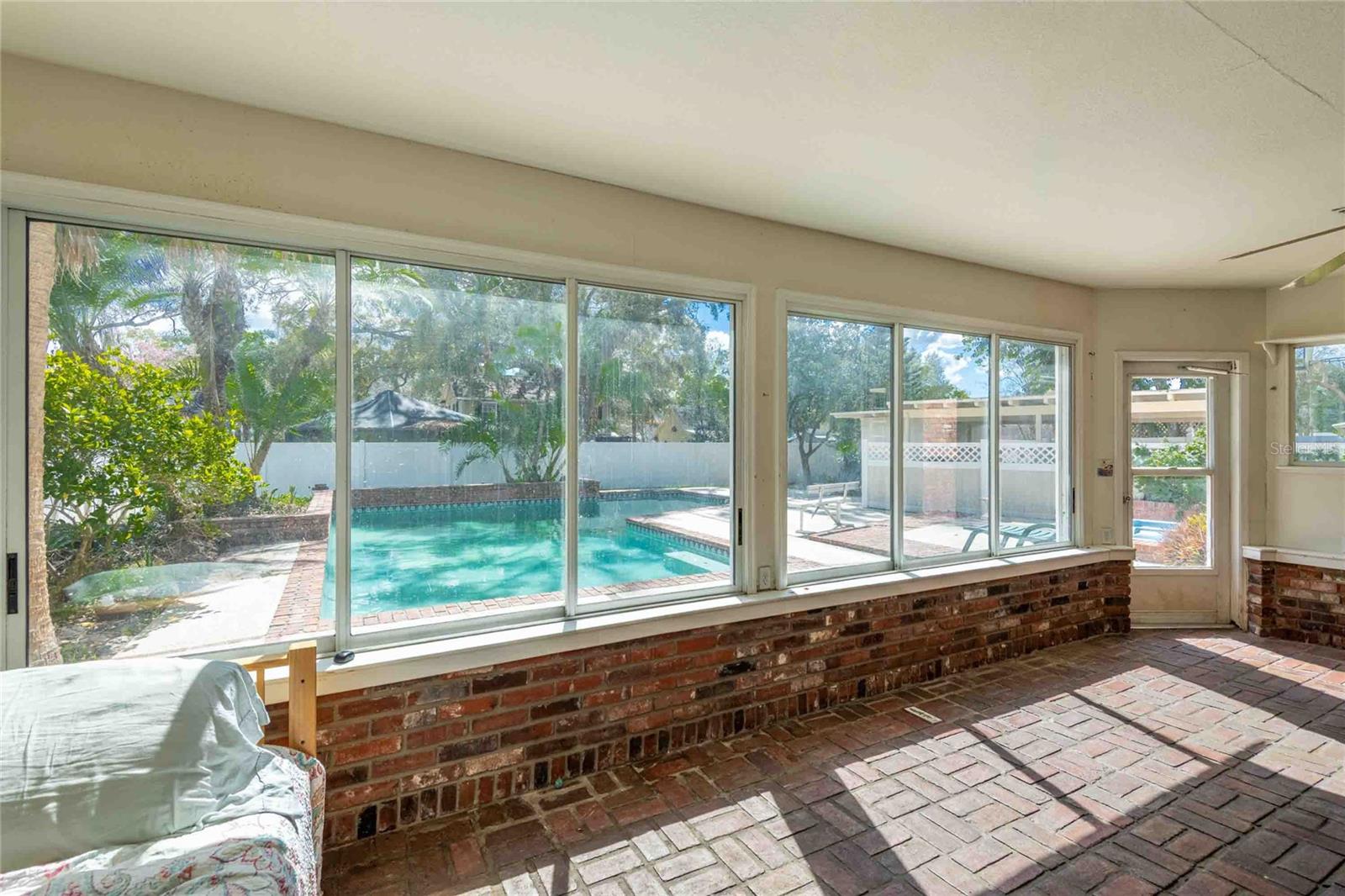 GREAT VIEW OF THE POOL FROM THE SUNROOM.