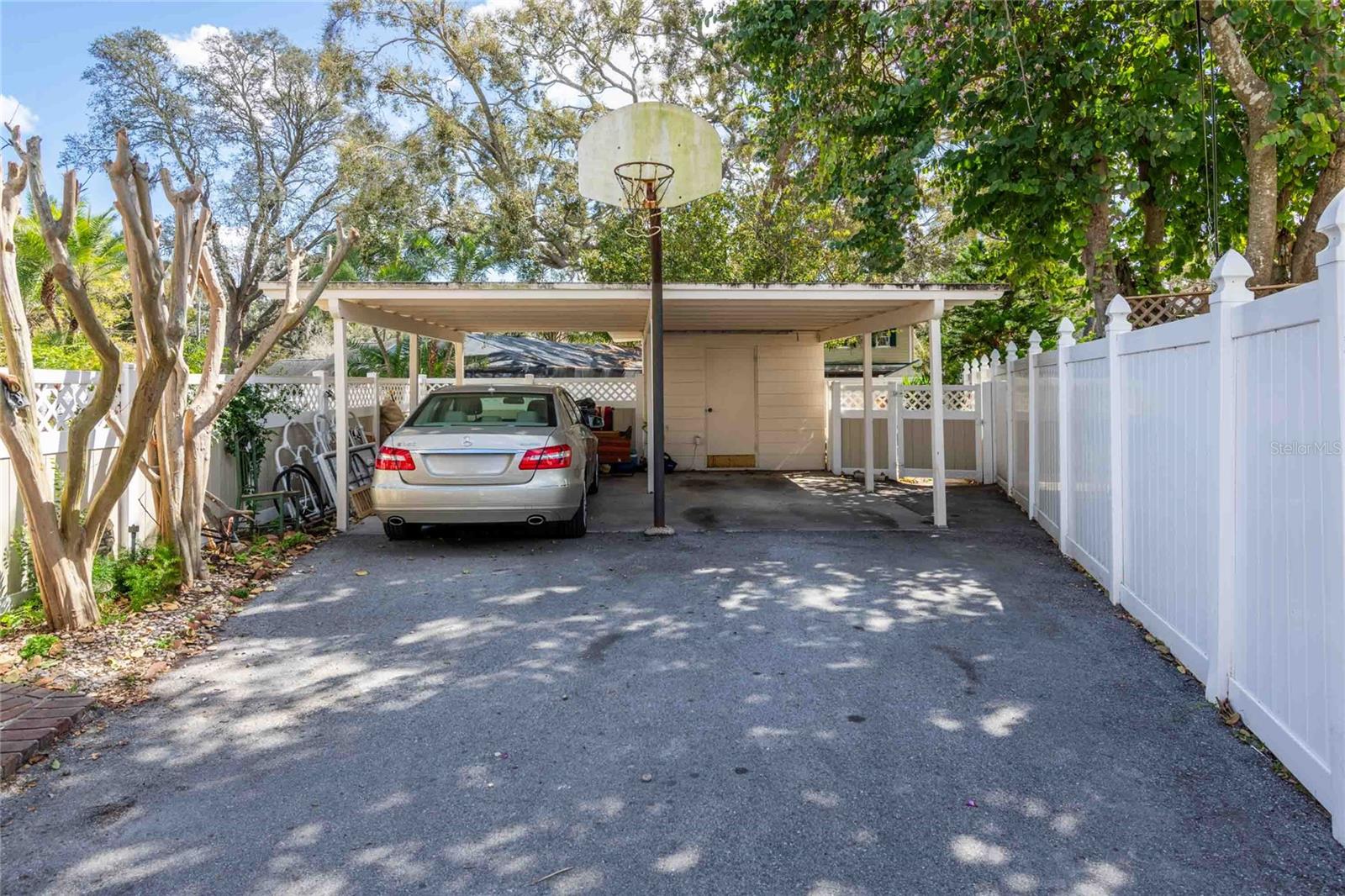 2 CAR CARPORT WITH UTILITY ROOM / STORAGE.