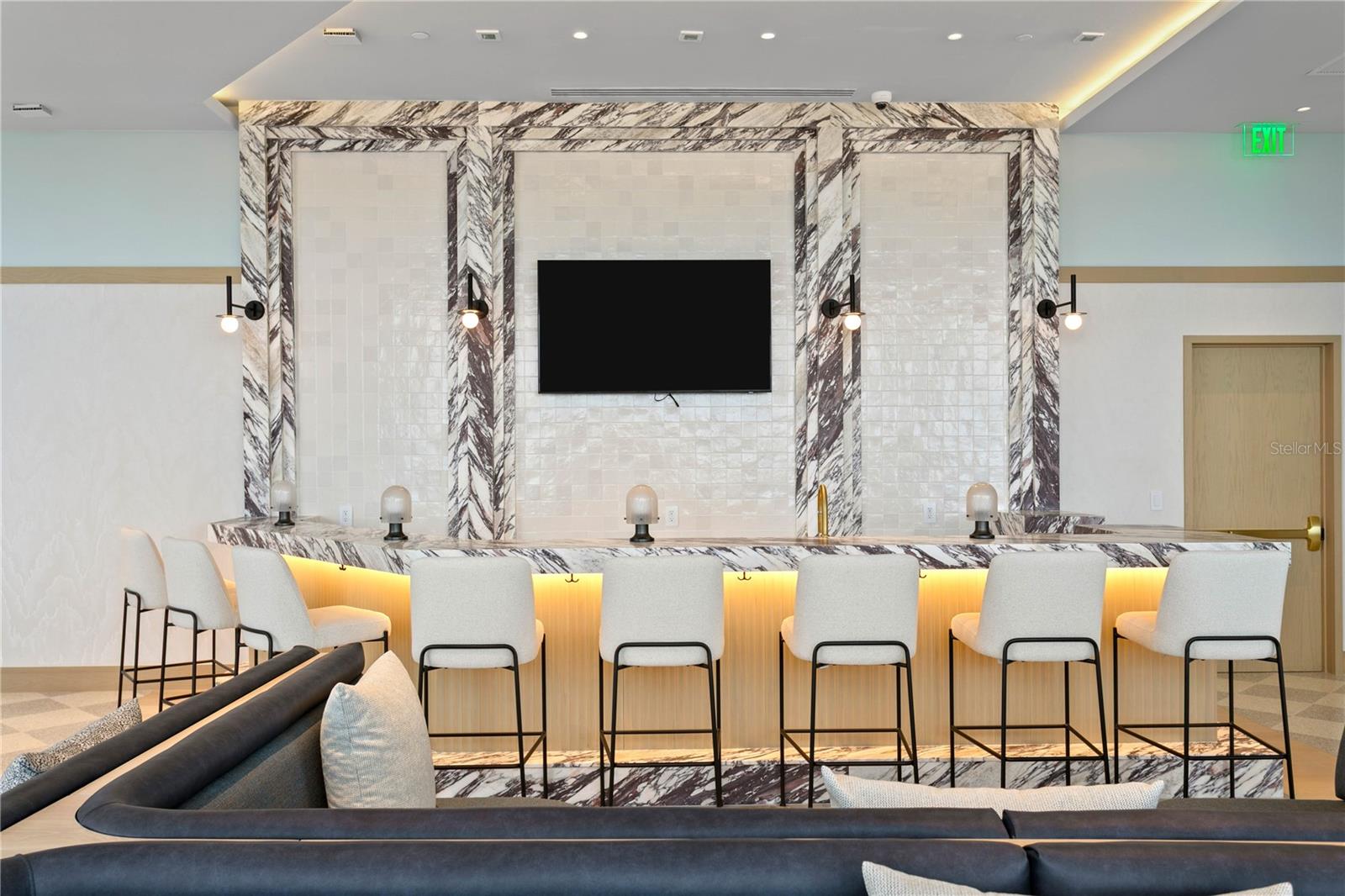 Full-service bar offering cocktails, wine, and light bites in a refined setting