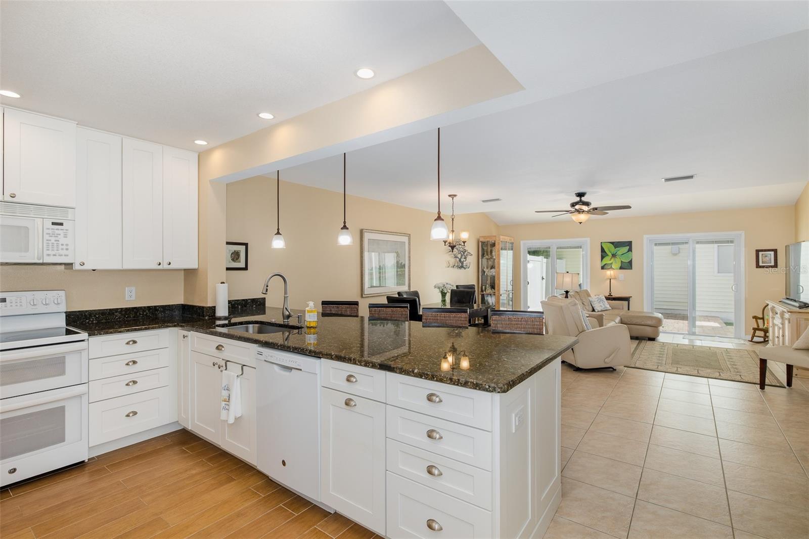 Kitchen overlooking dining room and living room